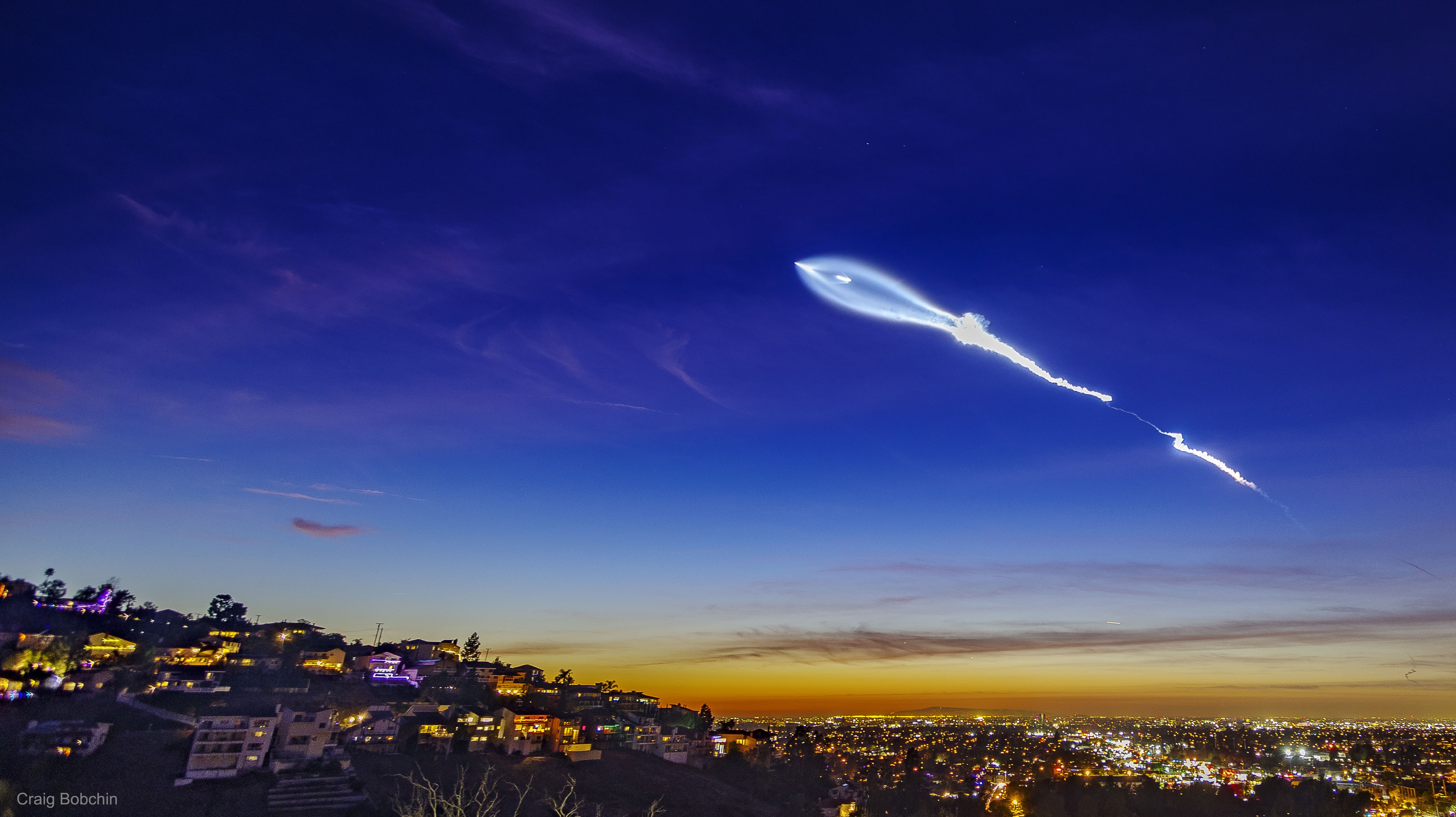 What's happened to the sky? On Friday, the photogenic launch plume from a SpaceX rocket launch created quite a spectacle over parts of southern California and Arizona. Looking at times like a giant space fish, the impressive rocket launch from Vandenberg Air Force Base near Lompoc, California, was so bright because it was backlit by the setting Sun. Lifting off during a minuscule one-second launch window, the Falcon 9 rocket successfully delivered to low Earth orbit ten Iridium NEXT satellites that are part of a developing global communications network. The plume from the first stage is seen on the right, while the soaring upper stage rocket is seen at the apex of the plume toward the left. Several good videos of the launch were taken. The featured image was captured from Orange County, California, in a 2.5 second duration exposure. Gallery: More images of the SpaceX launch