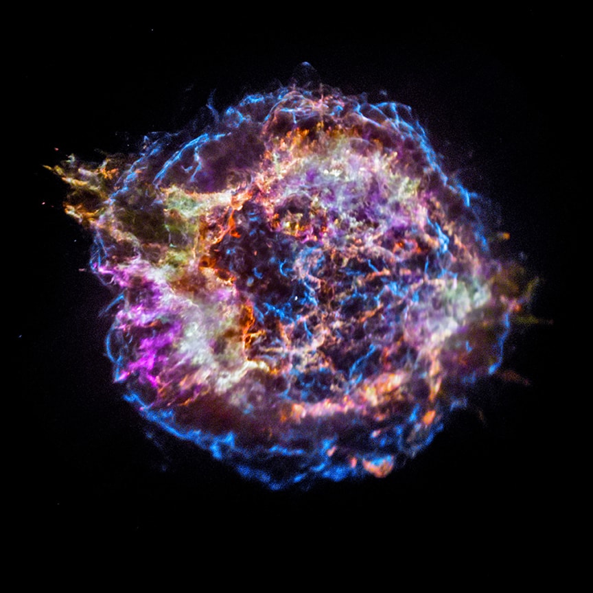 Massive stars in our Milky Way Galaxy live spectacular lives. Collapsing from vast cosmic clouds, their nuclear furnaces ignite and create heavy elements in their cores. After a few million years, the enriched material is blasted back into interstellar space where star formation can begin anew. The expanding debris cloud known as Cassiopeia A is an example of this final phase of the stellar life cycle. Light from the explosion which created this supernova remnant would have been first seen in planet Earth's sky about 350 years ago, although it took that light about 11,000 years to reach us. This false-color Chandra X-ray Observatory image shows the still hot filaments and knots in the Cassiopeia A remnant. High-energy emission from specific elements has been color coded, silicon in red, sulfur in yellow, calcium in green and iron in purple, to help astronomers explore the recycling of our galaxy's star stuff - Still expanding, the blast wave is seen as the blue outer ring. The sharp X-ray image, spans about 30 light-years at the estimated distance of Cassiopeia A. The bright speck near the center is a neutron star, the incredibly dense, collapsed remains of the massive stellar core.