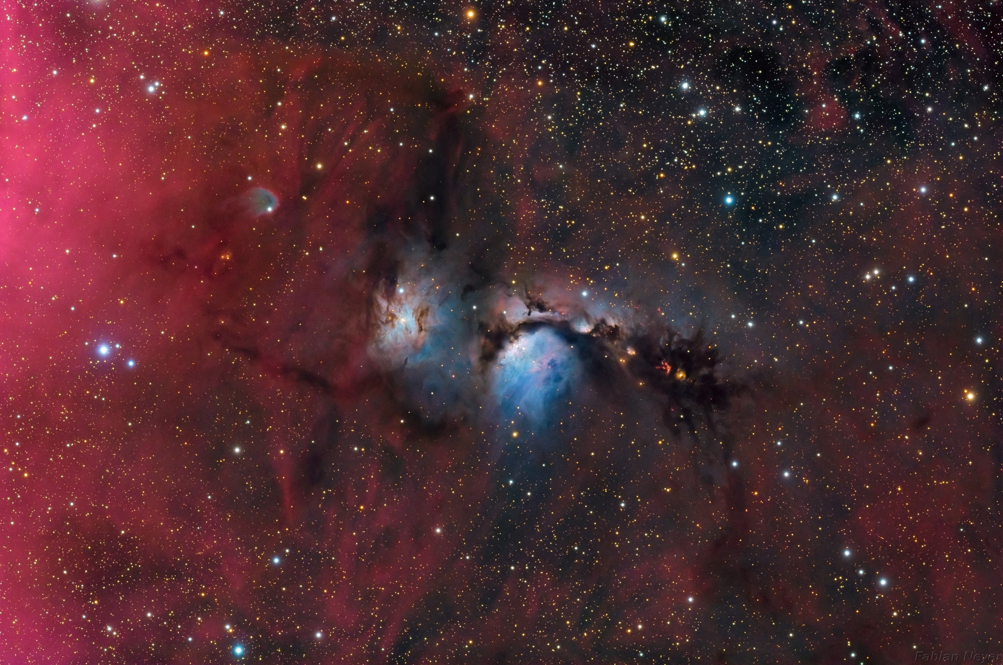 Interstellar dust clouds and glowing nebulae abound in the fertile constellation of Orion. One of the brightest, M78, is centered in this colorful, wide field view, covering an area north of Orion's belt. At a distance of about 1,500 light-years, the bluish reflection nebula is around 5 light-years across. Its tint is due to dust preferentially reflecting the blue light of hot, young stars. Reflection nebula NGC 2071 is just to the left of M78. To the right, and much more compact in appearance, the intriguing McNeil's Nebula is a recently recognized variable nebula associated with a young sun-like star. Deeper red flecks of emission from Herbig-Haro objects, energetic jets from stars in the process of formation, stand out against the dark dust lanes. The exposure also brings out the region's fainter pervasive glow of atomic hydrogen gas.