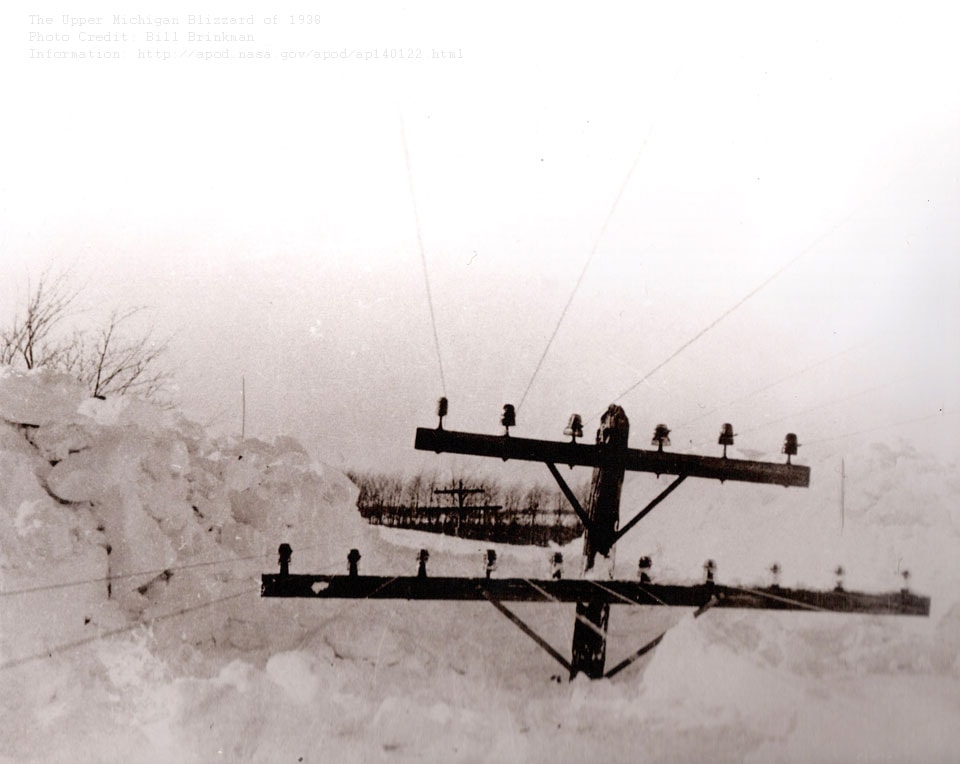Yes, but can your blizzard do this? In Upper Michigan's Storm of the Century in 1938, some snow drifts reached the level of utility poles. Nearly a meter of new and unexpected snow fell over two days in a storm that started 80 years ago this week. As snow fell and gale-force winds piled snow to surreal heights; many roads became not only impassable but unplowable; people became stranded; cars, school buses and a train became mired; and even a dangerous fire raged. Fortunately only two people were killed, although some students were forced to spend several consecutive days at school. The featured image was taken by a local resident soon after the storm. Although all of this snow eventually melted, repeated snow storms like this help build lasting glaciers in snowy regions of our planet Earth.