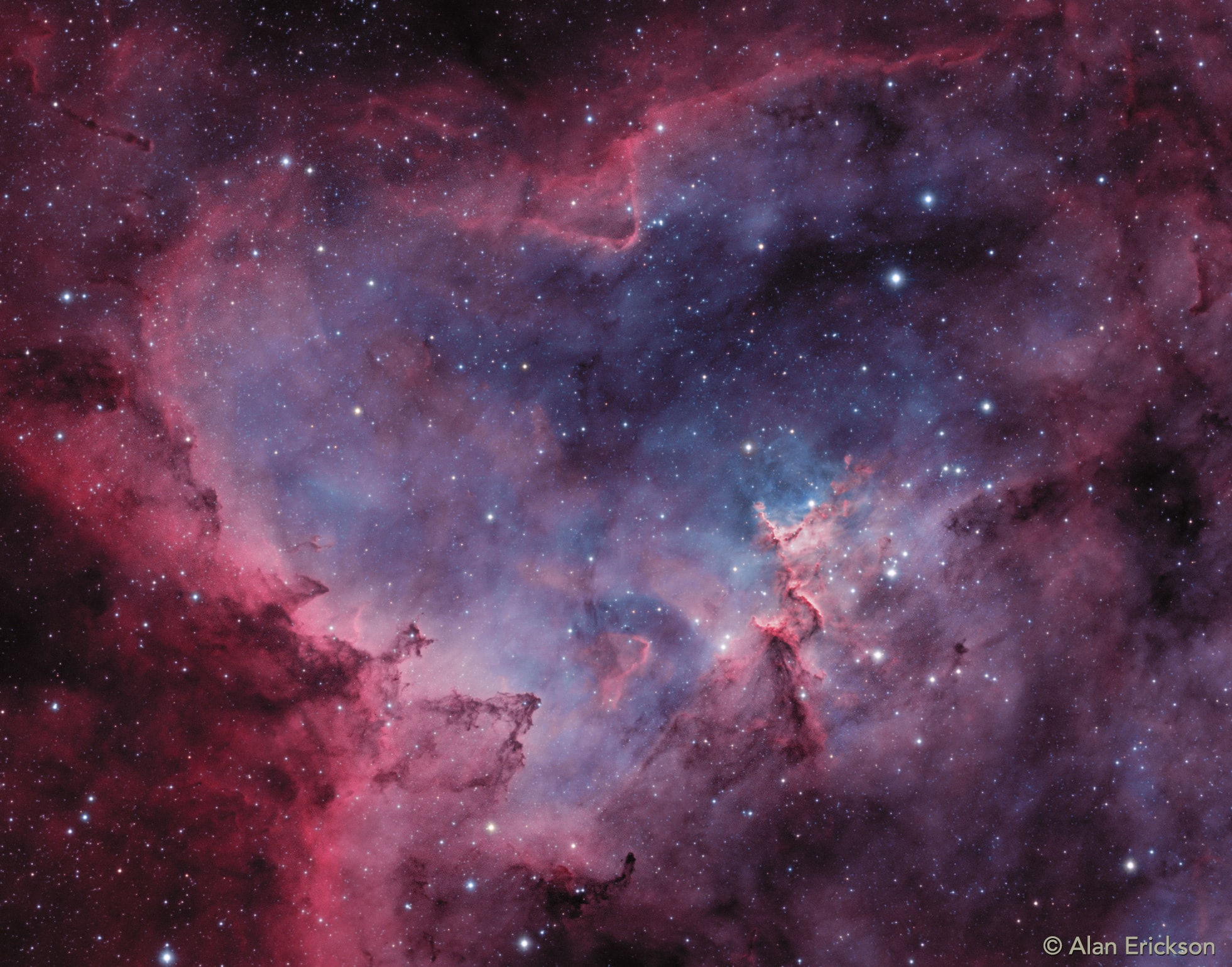 What's that inside the Heart Nebula? First, the large emission nebula dubbed IC 1805 looks, in whole, like a human heart. It's shape perhaps fitting of the Valentine's Day, this heart glows brightly in red light emitted by its most prominent element: hydrogen. The red glow and the larger shape are all created by a small group of stars near the nebula's center. In the heart of the Heart Nebula are young stars from the open star cluster Melotte 15 that are eroding away several picturesque dust pillars with their energetic light and winds. The open cluster of stars contains a few bright stars nearly 50 times the mass of our Sun, many dim stars only a fraction of the mass of our Sun, and an absent microquasar that was expelled millions of years ago. The Heart Nebula is located about 7,500 light years away toward the constellation of the mythological Queen of Aethiopia (Cassiopeia).
