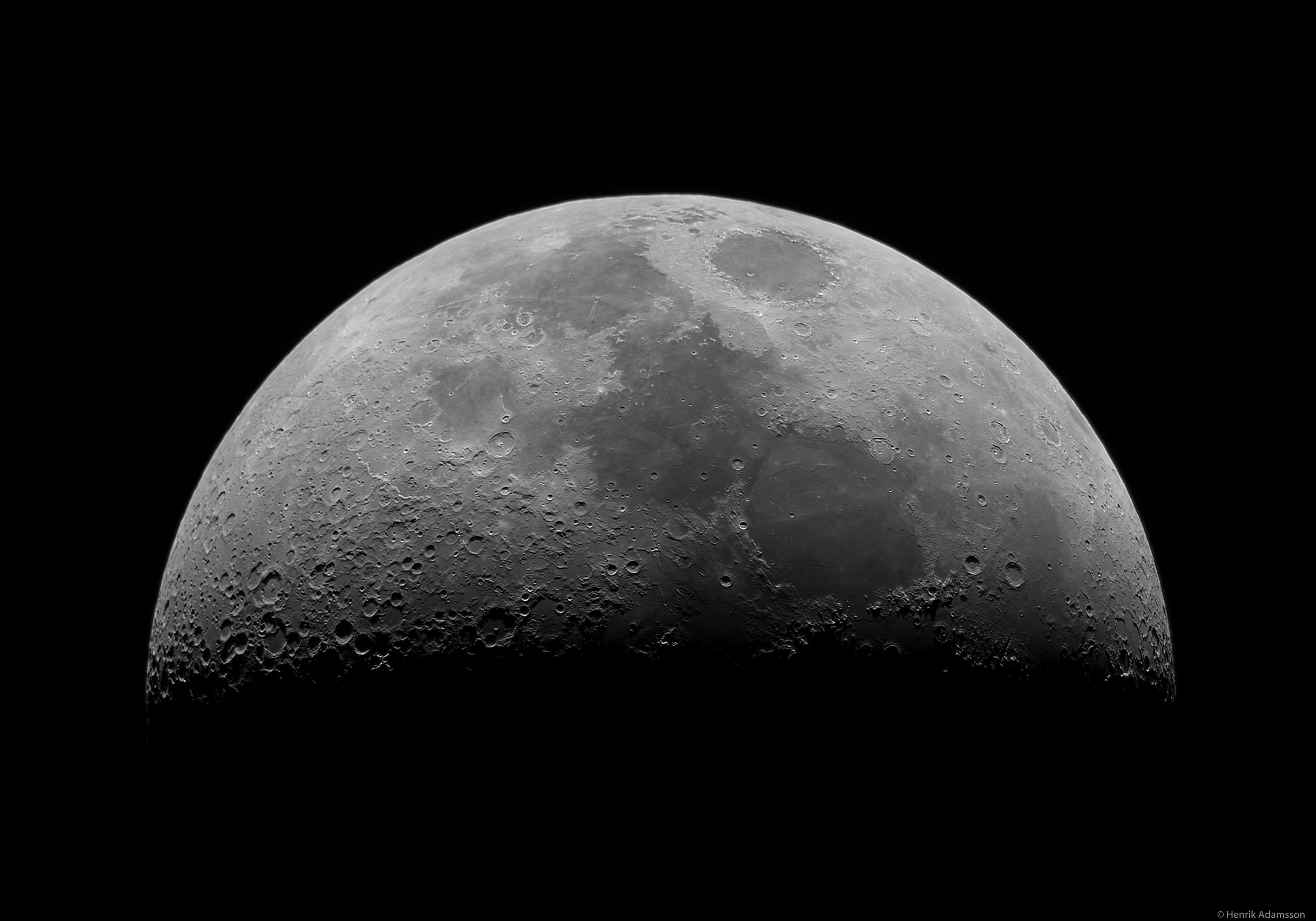 The striking X in this lunarscape is easily visible in binoculars or a small telescope, but not too many have seen it. The catch is, this lunar X is fleeting and only apparent in the hours before the Moon's first quarter phase. Along the shadow line between lunar day and night, the X illusion is produced by a configuration of craters seen here toward the left, Blanchinus, La Caille and Purbach. Near the Moon's first quarter phase, an astronaut standing close to the craters' position would see the slowly rising Sun very near the horizon. Temporarily, crater walls would be in sunlight while crater floors would still be in darkness. Seen from planet Earth, contrasting sections of bright walls against the dark floors by chance look remarkably like an X. This sharp image of the Lunar X was captured on February 22nd. For extra credit, sweep your gaze along the lunar terminator and you can also spot the Lunar V.