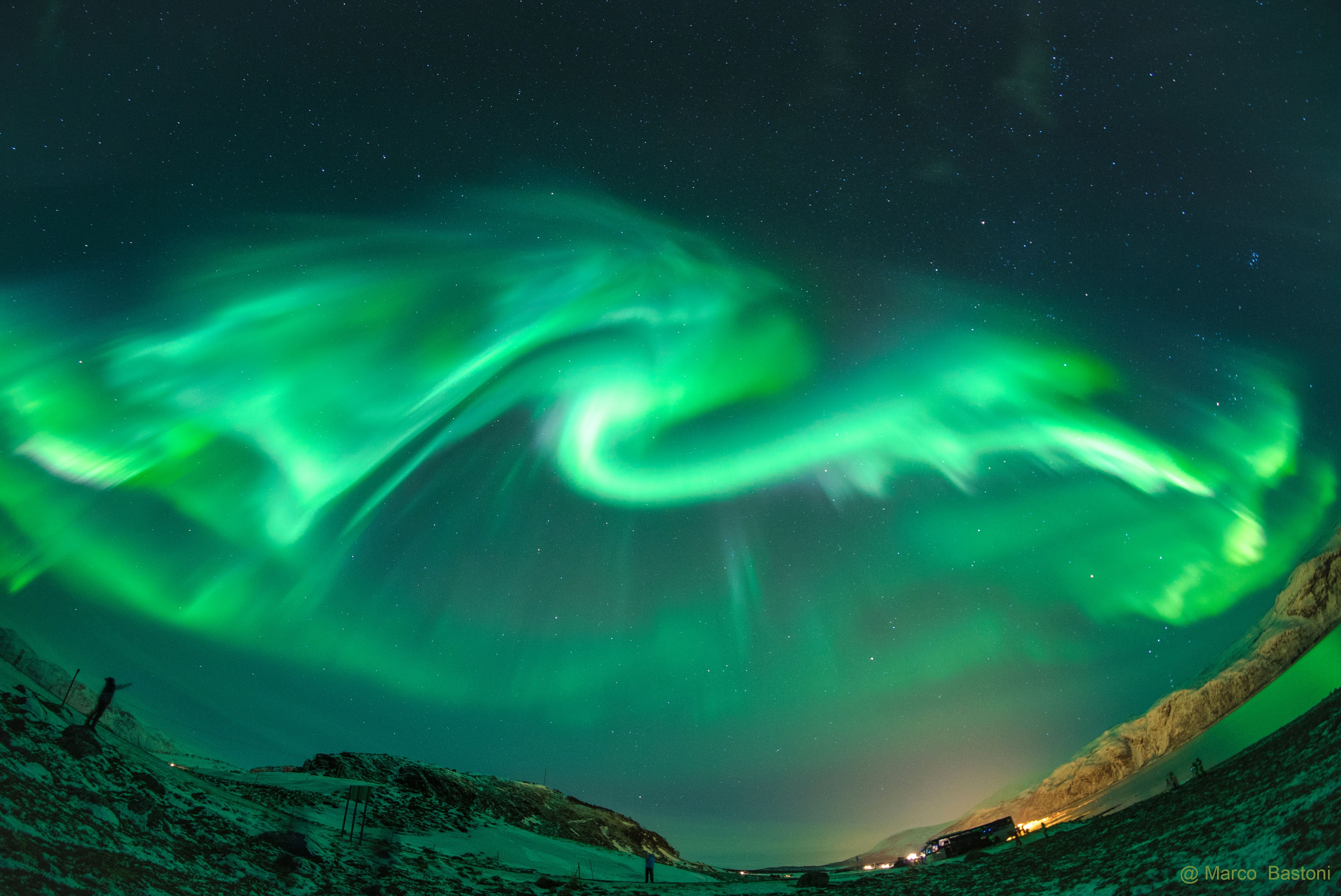 What's that in the sky? An aurora. A large coronal hole opened last month, a few days before this image was taken, throwing a cloud of fast moving electrons, protons, and ions toward the Earth. Some of this cloud impacted our Earth's magnetosphere and resulted in spectacular auroras being seen at high northern latitudes. Featured here is a particularly photogenic auroral curtain captured above Troms� Norway. To the astrophotographer, this shimmering green glow of recombining atmospheric oxygen appeared as a large dragon, but feel free to share what it looks like to you. Although now past Solar Maximum, our Sun continues to show occasional activity creating impressive auroras on Earth visible even last week.