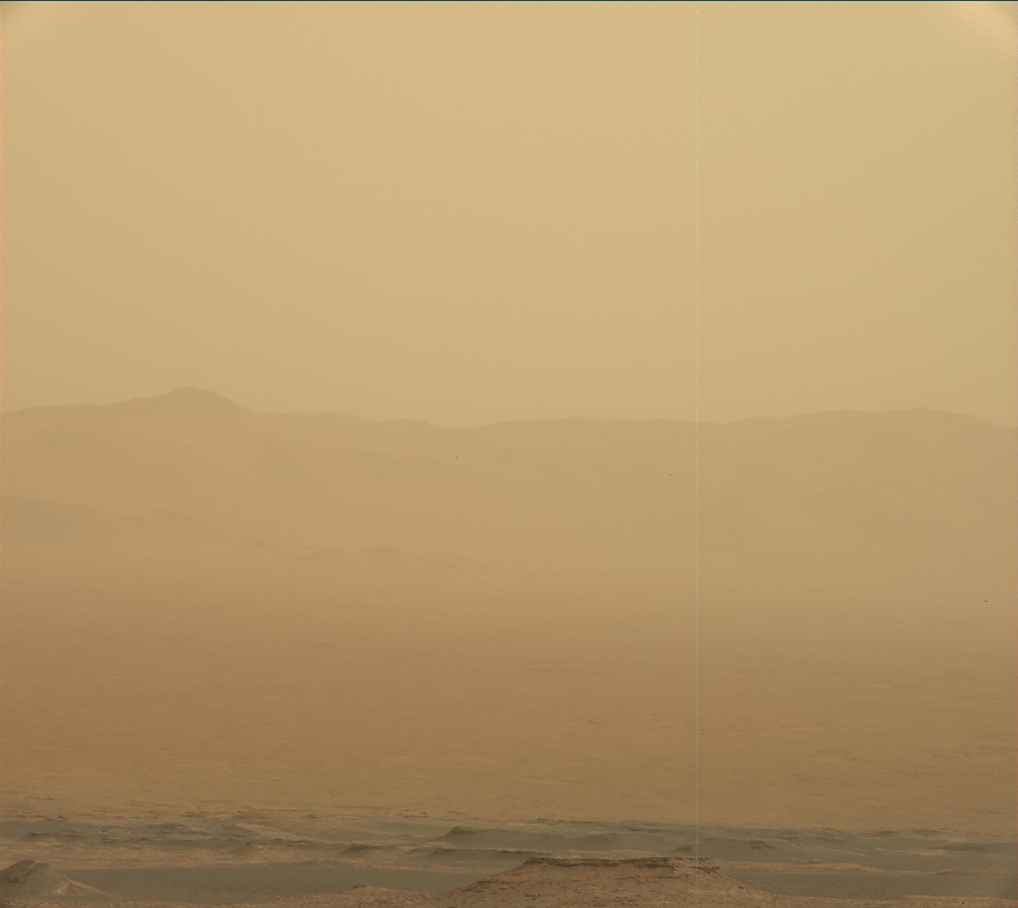 It's storm season on Mars. Dusty with a chance of dust is the weather report for Gale crater as a recent planet-scale dust storm rages. On June 10 looking toward the east-northeast crater rim about 30 kilometers away, the Curiosity rover's Mastcam captured this image of its local conditions so far. Meanwhile over 2,000 kilometers away, the Opportunity rover ceased science operations as the storm grew thicker at its location on the west rim of Endeavour crater, and has stopped communicating, waiting out the storm for now. Curiosity is powered by a radioisotope thermoelectric generator, but the smaller Opportunity rover uses solar panels to charge its batteries. For Opportunity, the increasingly severe lack of sunlight has caused its batteries to run low.