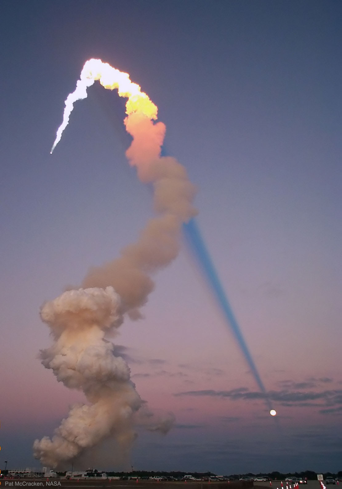 Why would the shadow of a space shuttle launch plume point toward the Moon? In early 2001 during a launch of Atlantis, the Sun, Earth, Moon, and rocket were all properly aligned for this photogenic coincidence. First, for the space shuttle's plume to cast a long shadow, the time of day must be either near sunrise or sunset. Only then will the shadow be its longest and extend all the way to the horizon. Finally, during a Full Moon, the Sun and Moon are on opposite sides of the sky. Just after sunset, for example, the Sun is slightly below the horizon, and, in the other direction, the Moon is slightly above the horizon. Therefore, as Atlantis blasted off, just after sunset, its shadow projected away from the Sun toward the opposite horizon, where the Full Moon happened to be.