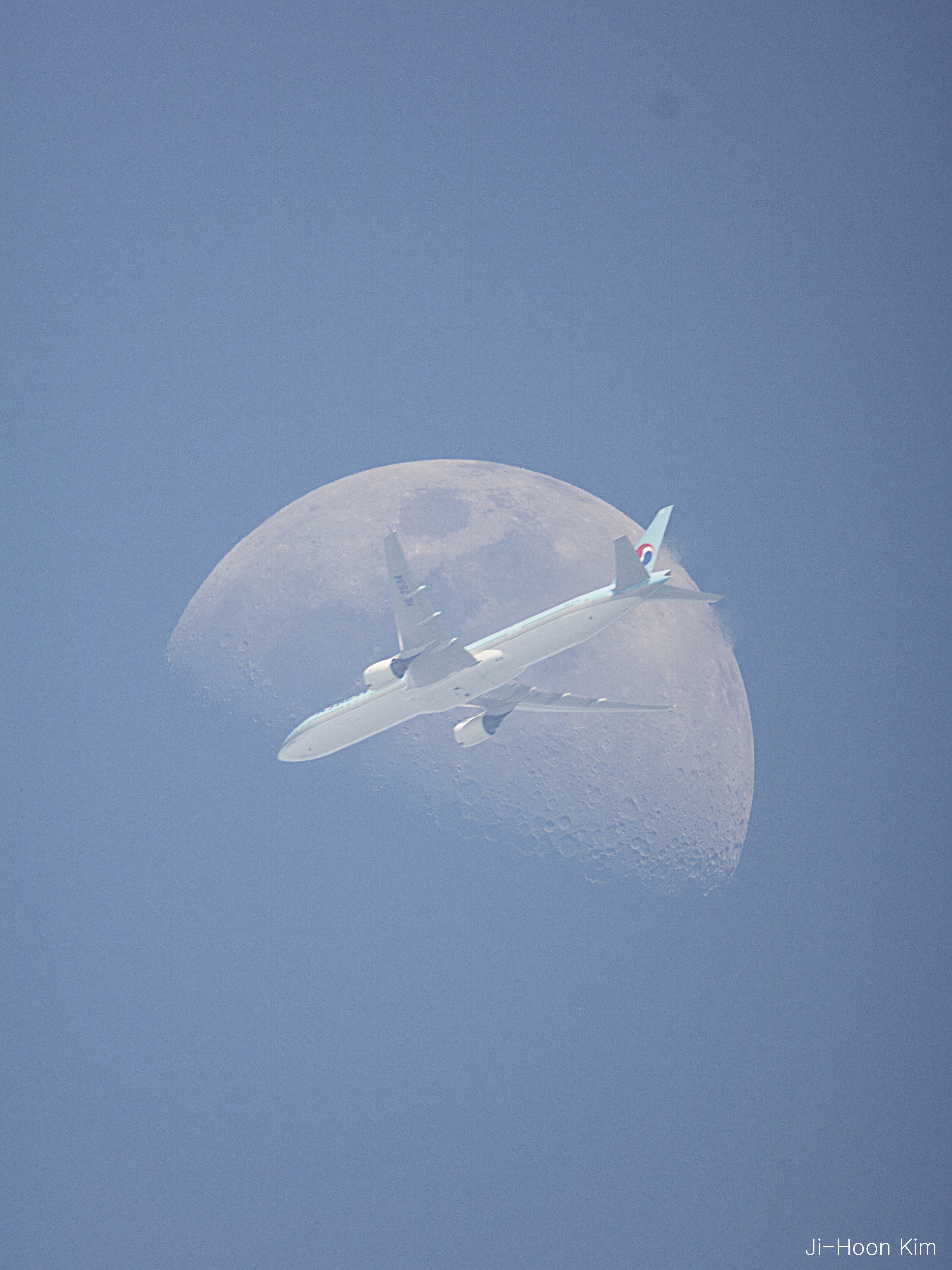 If you look closely at the Moon, you will see a large airplane in front of it. Well, not always. OK, hardly ever. Actually, to capture an image like this takes precise timing, an exposure fast enough to freeze the airplane and not overexpose the Moon -- but slow enough to see both, a steady camera, and luck -- because not every plane that approaches the Moon crosses in front. Helpful equipment includes a camera with fast continuous video mode and a mount that automatically tracks the Moon. The featured fleeting superposition was captured from Seoul, South Korea two weeks ago during a daytime waxing gibbous moonrise. Within 1/10th of a second, the airplane crossing was over. Follow APOD on: Facebook, Google Plus, Instagram, or Twitter