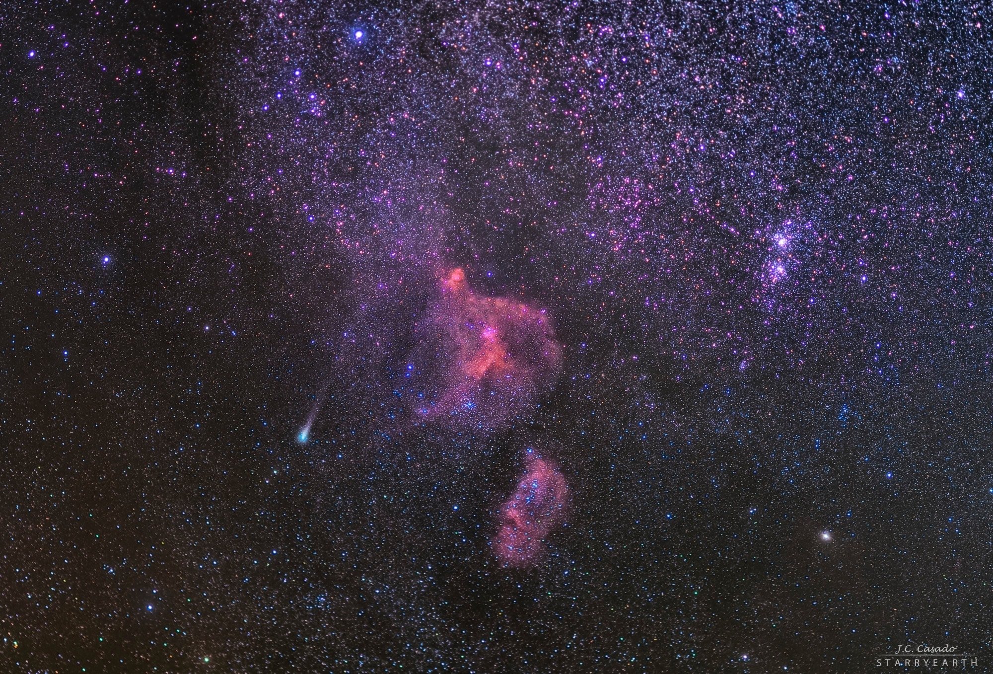 The greenish coma of comet 21P/Giacobini-Zinner stands out at the left of this telephoto skyscape spanning over 10 degrees toward the northern constellations Cassiopeia and Perseus. Captured on August 17, the periodic comet is the known parent body of the upcoming Draconid meteor shower. Predicted to be at its brightest next month, the comet is actually in the foreground of the rich starfield, only about 4 light-minutes from our fair planet. Giacobini-Zinner should remain too faint for your eye to see though, like the colorful Heart and Soul nebulae near the center of the sensitive digital camera's field of view. But the pair of open star clusters at the right, h and Chi Persei, could just be seen by the unaided eye from dark locations. The Heart and Soul nebulae with their own embedded clusters of young stars a million or so years old, are each over 200 light-years across and 6 to 7 thousand light-years away. They are part of a large, active star forming complex sprawling along the Perseus spiral arm of our Milky Way Galaxy. Also known as the Double Cluster, h and Chi Persei are located at about that same distance. Periodic Giacobini-Zinner was visited by a spacecraft from Earth when the repurposed International Cometary Explorer passed through its tail in September 1985.