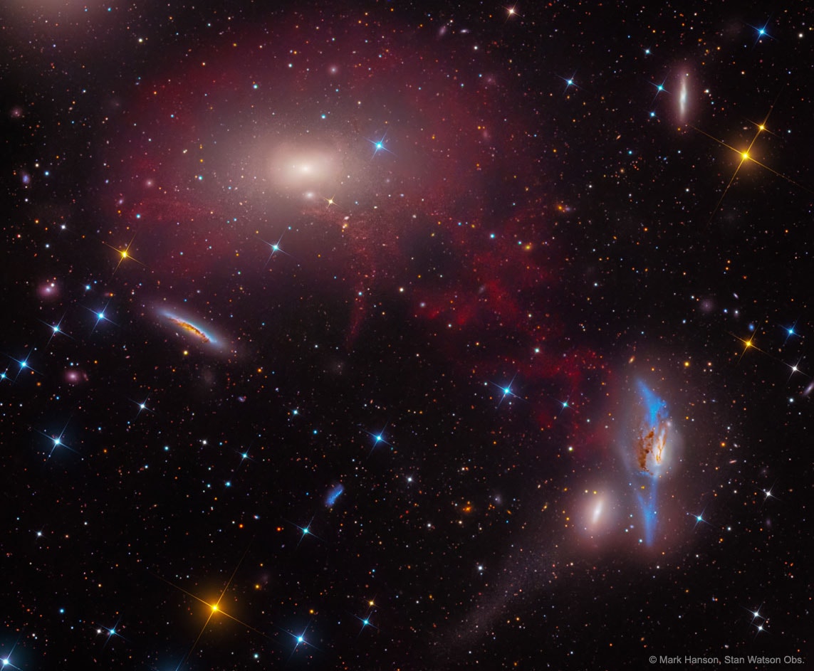 Is there a bridge of gas connecting these two great galaxies? Quite possibly, but it is hard to be sure. M86 on the upper left is a giant elliptical galaxy near the center of the nearby Virgo Cluster of galaxies. Our Milky Way Galaxy is falling toward the Virgo Cluster, located about 50 million light years away. To the lower right of M86 is unusual spiral galaxy NGC 4438, which, together with angular neighbor NGC 4435, are known as the Eyes Galaxies (also Arp 120). Featured here is one of the deeper images yet taken of the region, indicating that red-glowing gas surrounds M86 and seemingly connects it to NGC 4438. The image spans about the size of the full moon. It is also known, however, that cirrus gas in our own Galaxy is superposed in front of the Virgo cluster, and observations of the low speed of this gas seem more consistent with this Milky Way origin hypothesis. A definitive answer may come from future research, which may also resolve how the extended blue arms of NGC 4438 were created. Open Science: Browse 1,750+ codes in the Astrophysics Source Code Library