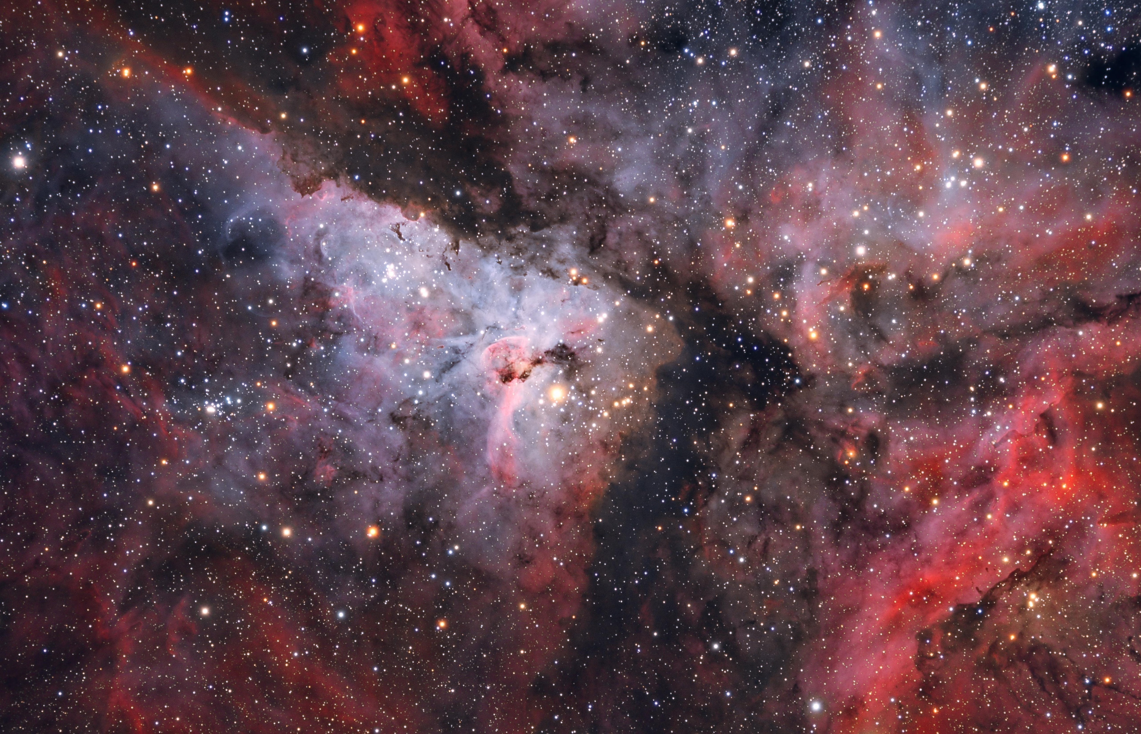 A jewel of the southern sky, the Great Carina Nebula, also known as NGC 3372, spans over 300 light-years, one of our galaxy's largest star forming regions. Like the smaller, more northerly Great Orion Nebula, the Carina Nebula is easily visible to the unaided eye, though at a distance of 7,500 light-years it is some 5 times farther away. This gorgeous telescopic close-up reveals remarkable details of the region's central glowing filaments of interstellar gas and obscuring cosmic dust clouds. The field of view is over 50 light-years across. The Carina Nebula is home to young, extremely massive stars, including the stars of open cluster Trumpler 14 (above and left of center) and the still enigmatic variable Eta Carinae, a star with well over 100 times the mass of the Sun. Eta Carinae is the brightest star, centered here just below the dusty Keyhole Nebula (NGC 3324). While Eta Carinae itself maybe on the verge of a supernova explosion, X-ray images indicate that the Great Carina Nebula has been a veritable supernova factory.
