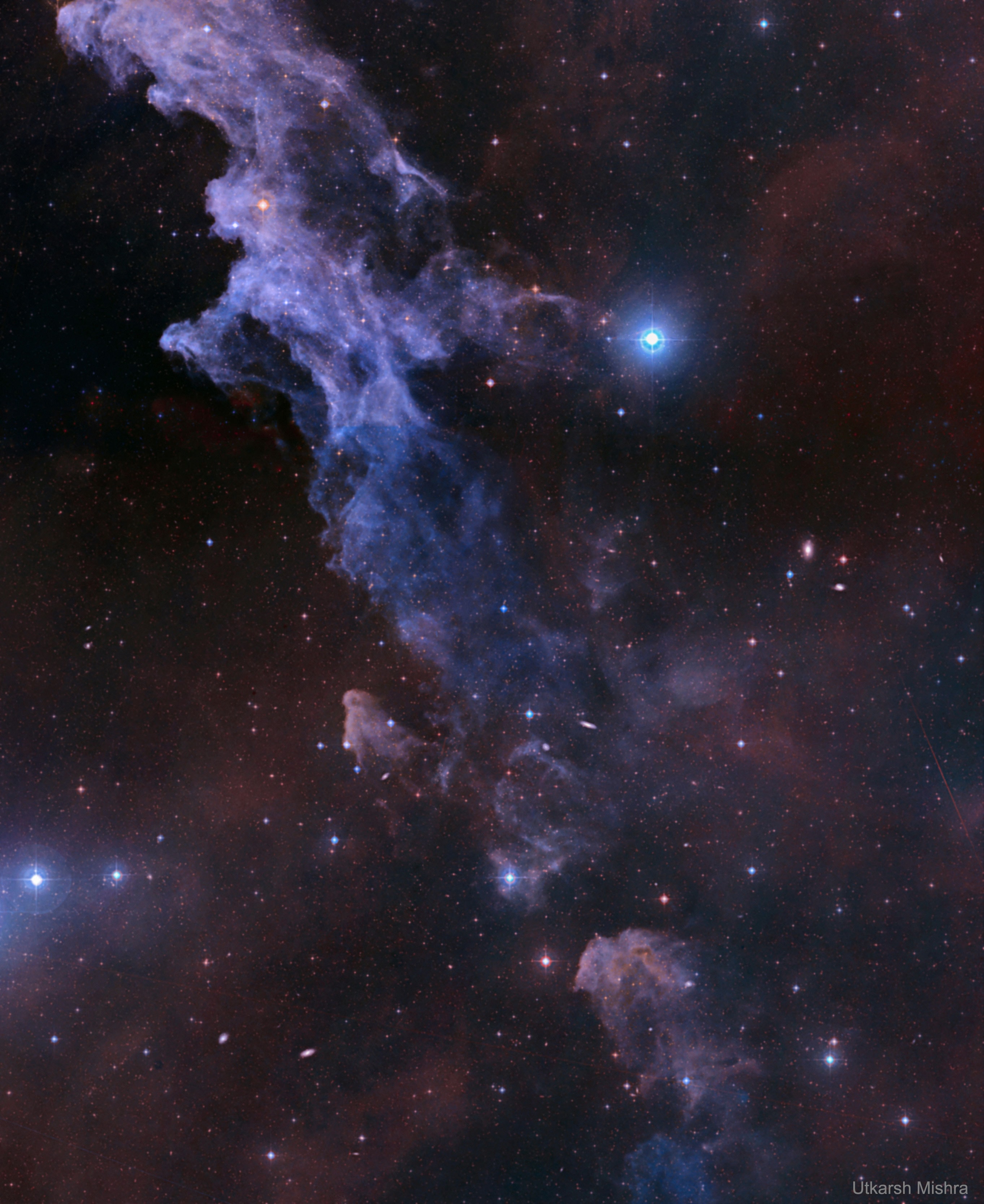 Double, double toil and trouble; Fire burn, and cauldron bubble .... maybe Macbeth should have consulted the Witch Head Nebula. A frighteningly shaped reflection nebula, this cosmic crone is about 800 light-years away though. Its malevolent visage seems to glare toward nearby bright star Rigel in Orion, just off the left edge of this frame. More formally known as IC 2118, the interstellar cloud of dust and gas is nearly 70 light-years across, its dust grains reflecting Rigel's starlight. In this composite portrait, the nebula's color is caused not only by the star's intense bluish light but because the dust grains scatter blue light more efficiently than red. The same physical process causes Earth's daytime sky to appear blue, although the scatterers in planet Earth's atmosphere are molecules of nitrogen and oxygen. Free Download: 2019 APOD Calendar (v5)