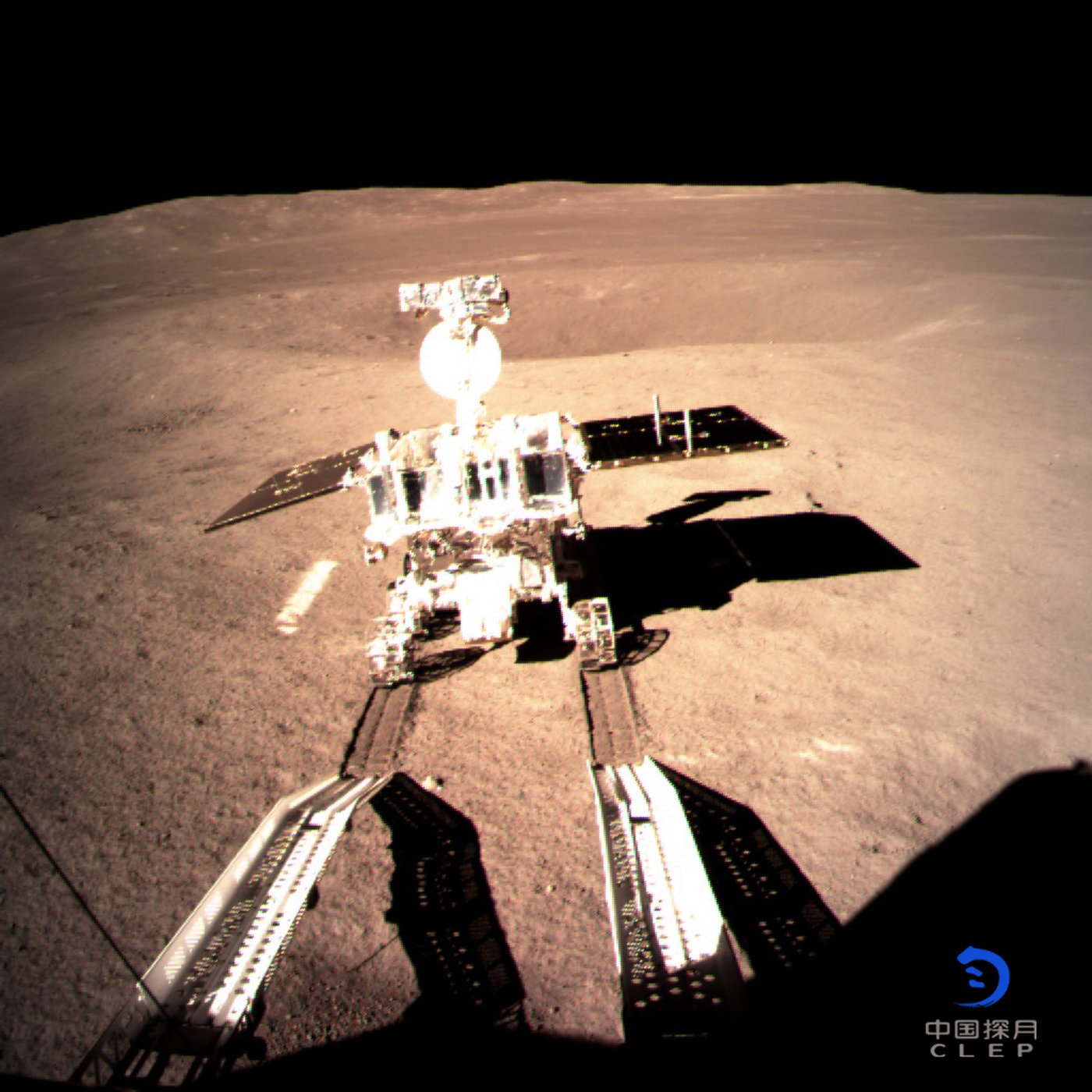 On January 3, the Chinese Chang'e-4 spacecraft made the first successful landing on the Moon's farside. Taken by a camera on board the lander, this image is from the landing site inside Von Karman crater. It shows the desk-sized, six-wheeled Yutu 2 (Jade Rabbit 2) rover as it rolled down lander ramps and across the surface near local sunrise and the start of the two week long lunar day. Ripe for exploration, Von Karman crater itself is 186 kilometers in diameter. It lies within the Moon's old and deep South Pole-Aitken impact basin with some of the most ancient and least understood lunar terrains. To bridge communications from the normally hidden hemisphere of the Moon, China launched a relay satellite, Queqiao, in May of 2018 in to an orbit beyond the lunar farside.