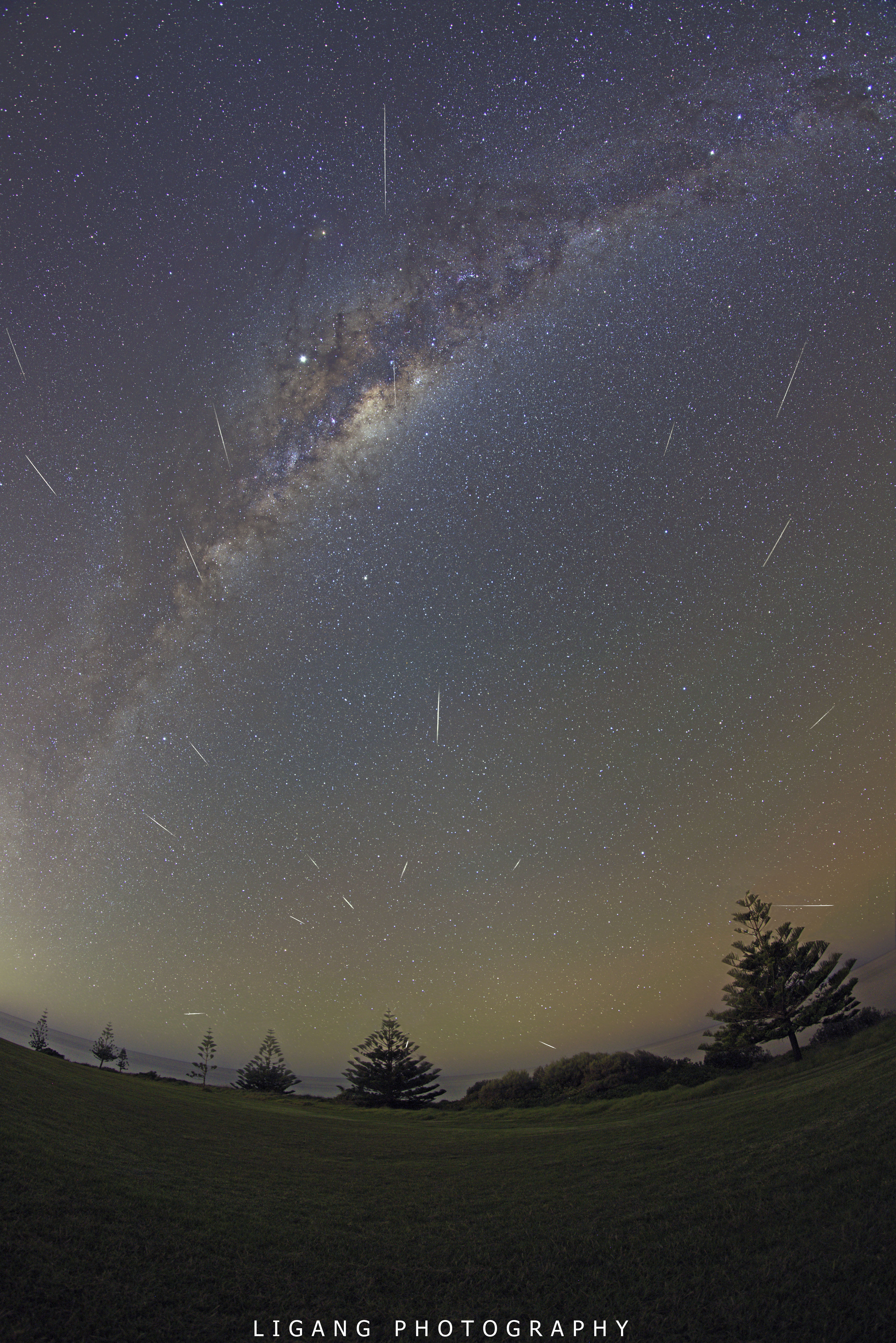 Grains of cosmic dust streaked through the mostly moonless night skies of May 7. Swept up as planet Earth plowed through the debris streams left behind by periodic Comet Halley, the annual meteor shower is known as the Eta Aquarids. Though it was made about a day after the shower's predicted maximum, this composite image still captures 20 meteors in exposures taken over a 2 hour period, registered on a background exposure of the sky. The meteor trails point back to the shower radiant near eponymous faint star Eta Aquarii close to the horizon, seen from 100 kilometers south of Sydney Australia. Known for speed, Eta Aquarid meteors move fast, entering the atmosphere at about 66 kilometers per second. Brilliant Jupiter shines near the central bulge of the Milky Way high above the horizon. The Southern Cross is just tucked in to the upper right corner of the frame.