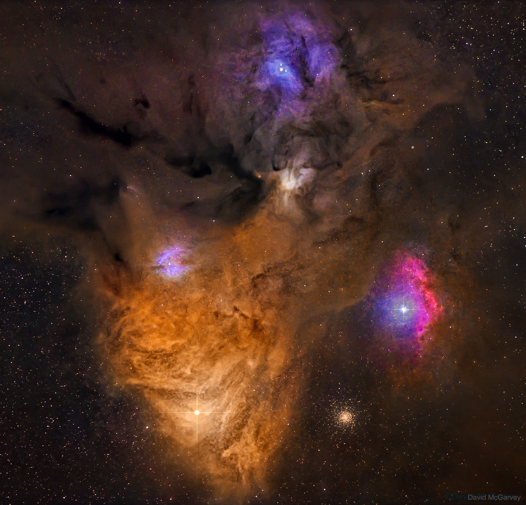 Why is the sky near Antares and Rho Ophiuchi so dusty yet colorful? The colors result from a mixture of objects and processes. Fine dust illuminated from the front by starlight produces blue reflection nebulae. Gaseous clouds whose atoms are excited by ultraviolet starlight produce reddish emission nebulae. Backlit dust clouds block starlight and so appear dark. Antares, a red supergiant and one of the brighter stars in the night sky, lights up the yellow-red clouds on the lower left of the featured image. Rho Ophiuchi lies at the center of the blue nebula near the top. The distant globular cluster M4 is visible to the right of Antares. These star clouds are even more colorful than humans can see, emitting light across the electromagnetic spectrum.
