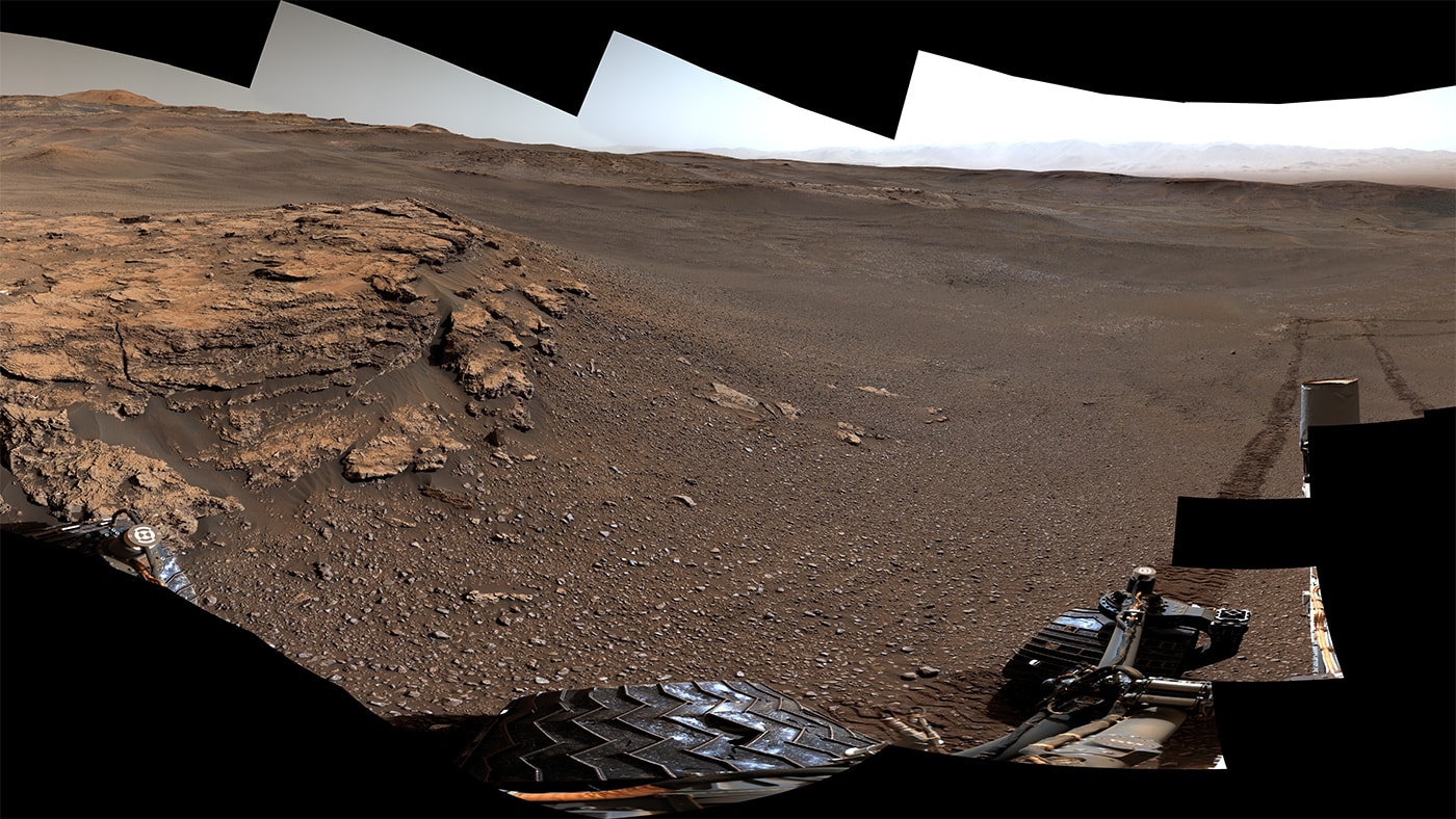 Part of a 360 degree panorama, this view looks out from the Mars rover Curiosity's current location on the Red Planet dubbed Teal Ridge. The mosaicked scene was captured by the rover's Mastcam on Earth calendar date June 18, 2019. That corresponds to Curiosity's sol 2440, or 2,440th martian day on the surface. Since landing seven years ago on August 6, 2012 in Gale Crater, Curiosity has traveled some 21 kilometers (13 miles). On the right, the rover's tracks lead back toward Vera Rubin Ridge with the Gale Crater rim visible in the distance. The robotic rover leaves wheel tracks about 3 meters (10 feet) apart. During its mission, Curiosity has had great successes exploring the history of water in the martian environment. In fact, NASA's Mars 2020 rover is largely based on the Mars Curiosity rover design. Watch: Perseid Meteor Shower