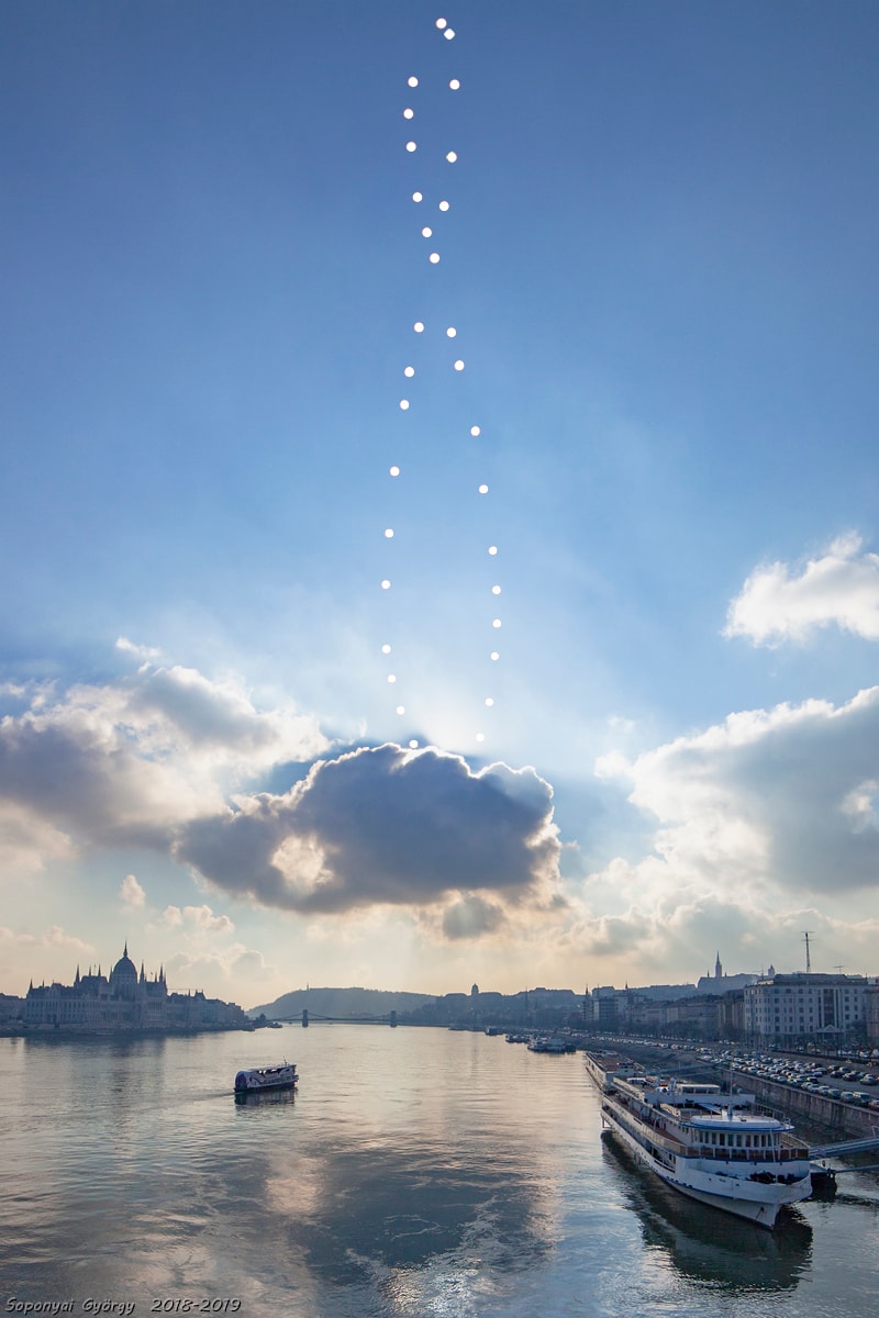 This week the equinox found the Sun near the middle, but not at the crossing point, of an analemma in its annual trek through planet Earth's skies. In this scenic view, that graceful, figure-8-shaped curve was intentionally posed above the iconic Danube River and the capital city of Hungary. Looking south from Budapest's Margaret Bridge it combines digital frames taken at exactly the same time of day (11:44 CET) on dates between 2018 September 24 and 2019 September 15. That puts the metropolitan Pest on the left, regal Buda on the right, and the positions of the Sun on the solstice dates at the top and bottom of the analemma curve. December's near solstice Sun is just hidden behind a dramatic cloud bank.