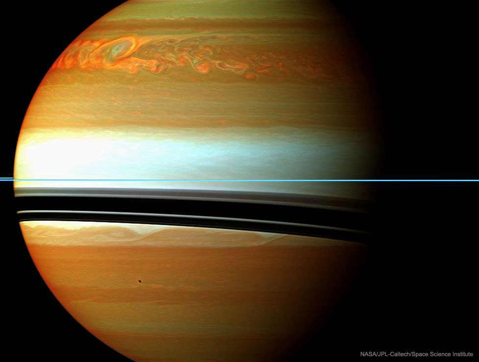 It was one of the largest and longest lived storms ever recorded in our Solar System. First seen in late 2010, the above cloud formation in the northern hemisphere of Saturn started larger than the Earth and soon spread completely around the planet. The storm was tracked not only from Earth but from up close by the robotic Cassini spacecraft then orbiting Saturn. Pictured here in false colored infrared in February, orange colors indicate clouds deep in the atmosphere, while light colors highlight clouds higher up. The rings of Saturn are seen nearly edge-on as the thin blue horizontal line. The warped dark bands are the shadows of the rings cast onto the cloud tops by the Sun to the upper left. A source of radio noise from lightning, the intense storm was thought to relate to seasonal changes when spring emerges in the north of Saturn. After raging for over six months, the iconic storm circled the entire planet and then tried to absorb its own tail -- which surprisingly caused it to fade away.