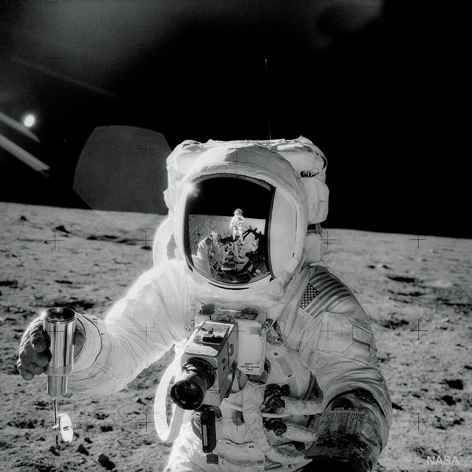 Is this image art? 50 years ago, Apollo 12 astronaut-photographer Charles "Pete" Conrad recorded this masterpiece while documenting colleague Alan Bean's lunar soil collection activities on Oceanus Procellarum. The featured image is dramatic and stark. The harsh environment of the Moon's Ocean of Storms is echoed in Bean's helmet, a perfectly composed reflection of Conrad and the lunar horizon. Works of photojournalists originally intent on recording the human condition on planet Earth, such as Lewis W. Hine's images from New York City in the early 20th century, or Margaret Bourke-White's magazine photography are widely regarded as art. Similarly many documentary astronomy and space images might also be appreciated for their artistic and esthetic appeal.