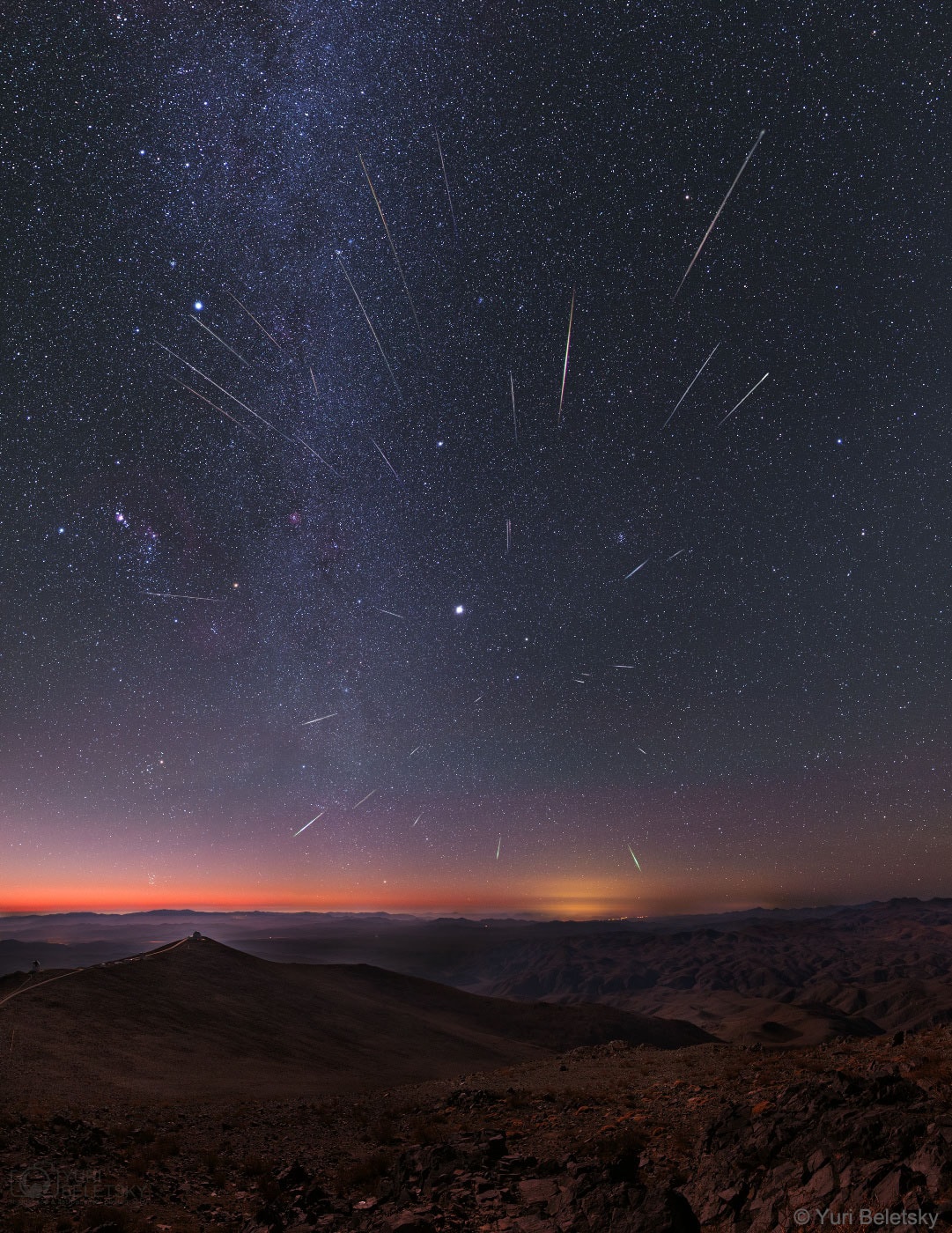 Are meteors streaming out from a point in the sky? Yes, in a way. When the Earth crosses a stream of Sun-orbiting meteors, these meteors appear to come from the direction of the stream -- with the directional point called the radiant.� An example occurs every mid-December for the Geminids meteor shower, as apparent in the featured image.� Recorded near the shower's peak in 2013, the featured skyscape captures Gemini's shooting stars in a four-hour composite from the dark skies of the Las Campanas Observatory in Chile. In the foreground the 2.5-meter du Pont Telescope is visible as well as the 1-meter SWOPE telescope. The skies beyond the meteors are highlighted by Jupiter, seen as the bright spot near the image center, the central band of our Milky Way Galaxy, seen vertically on the image left, and the pinkish Orion Nebula on the far left. Dust swept up from the orbit of active asteroid 3200 Phaethon, Gemini's meteors enter the atmosphere traveling at about 22 kilometers per second. The 2019 Geminid meteor shower peaks again this coming weekend.