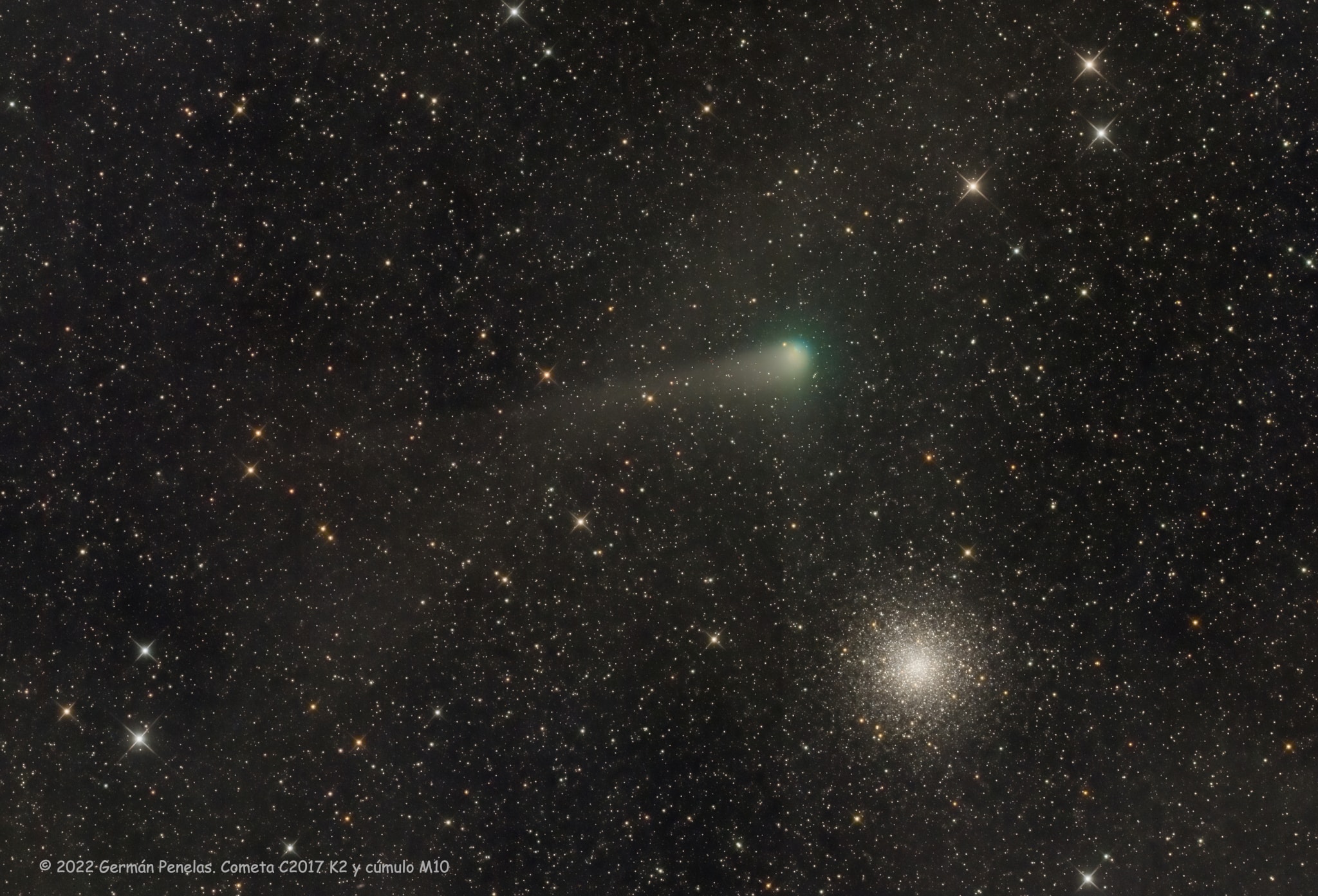 Imaged on July 15 2022, comet C/2017 K2 (PanSTARRS) had a Messier moment, sharing this wide telescopic field of view with globular star cluster Messier 10. Of course M10 was cataloged by 18th century comet hunter Charles Messier as the 10th object on his list of things that were definitely not comets. While M10 is about 14 thousand light-years distant, this comet PanSTARRS was about 15 light-minutes from our fair planet following its July 14 closest approach. Its greenish coma and dust tail entertaining 21st century comet watchers, C/2017 K2 is expected to remain a fine telescopic comet in northern summer skies. On a maiden voyage from our Solar System's remote Oort Cloud this comet PanSTARRS was discovered in May 2017 when it was beyond the orbit of Saturn. At the time that made it the most distant active inbound comet known. Its closest approach to the Sun will be within 1.8 astronomical units on December 19, beyond the orbital distance of Mars.