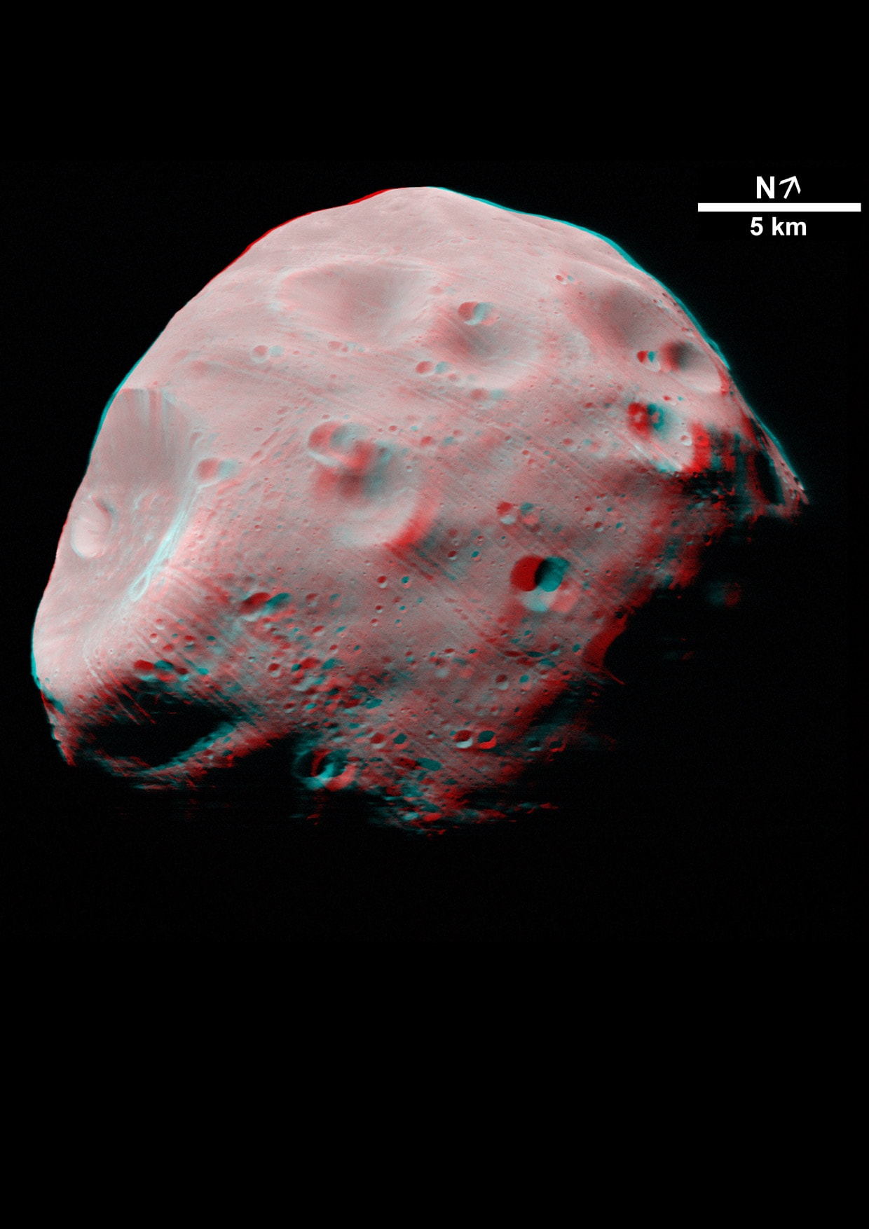 Get out your red/blue glasses and float next to Phobos, grooved moon of Mars! Captured in 2004 by the High Resolution Stereo Camera on board ESA's Mars Express spacecraft, the image data was recorded at a distance of about 200 kilometers from the martian moon. This tantalizing stereo anaglyph view shows the Mars-facing side of Phobos. It highlights the asteroid-like moon's cratered and grooved surface. Up to hundreds of meters wide, the mysterious grooves may be related to the impact that created Stickney crater, the large crater at the left. Stickney crater is about 10 kilometers across, while Phobos itself is only around 27 kilometers across at its widest point.