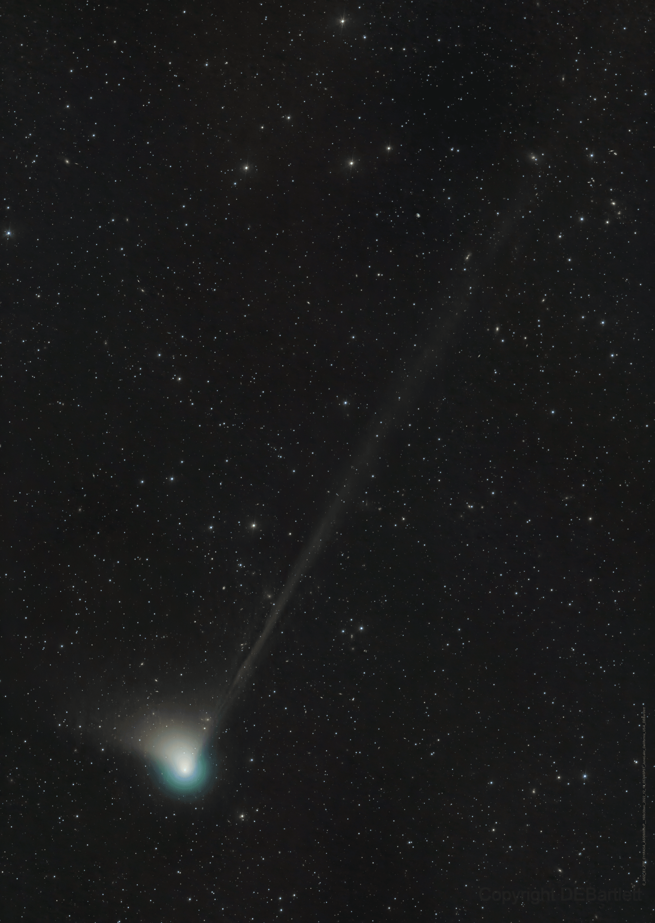 Comet C/2022 E3 (ZTF) was discovered by astronomers using the wide-field survey camera at the Zwicky Transient Facility this year in early March. Since then the new long-period comet has brightened substantially and is now sweeping across the northern constellation Corona Borealis in predawn skies. It's still too dim to see without a telescope though. But this fine telescopic image from December 19 does show the comet's brighter greenish coma, short broad dust tail, and long faint ion tail stretching across a 2.5 degree wide field-of-view. On a voyage through the inner Solar System comet 2022 E3 will be at perihelion, its closest to the Sun, in the new year on January 12 and at perigee, its closest to our fair planet, on February 1. The brightness of comets is notoriously unpredictable, but by then C/2022 E3 (ZTF) could become only just visible to the eye in dark night skies.