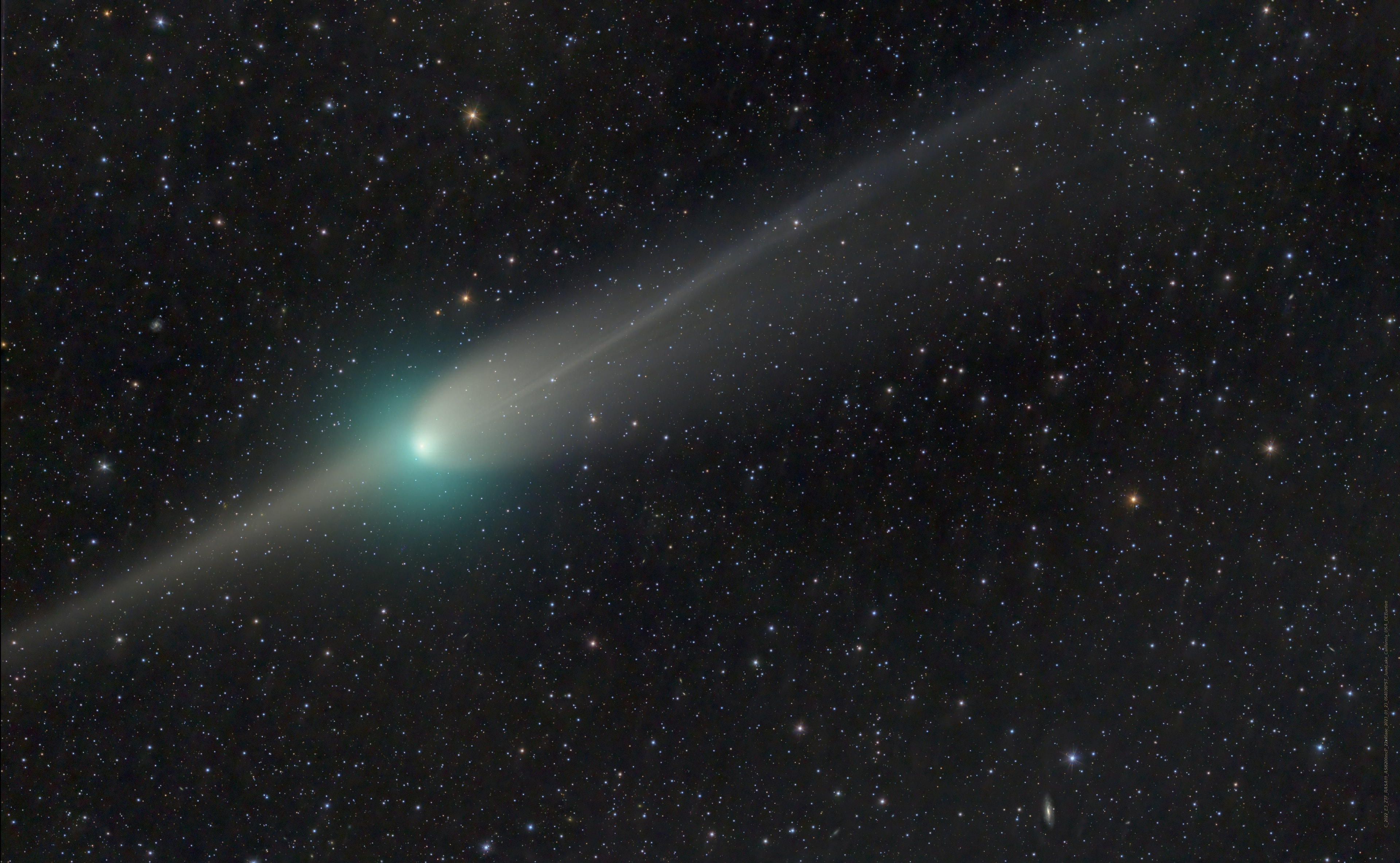 The current darling of the northern night, Comet C/2022 E3 ZTF is captured in this telescopic image from a dark sky location at June Lake, California, USA. Of course Comet ZTF has been growing brighter in recent days, headed for its closest approach to Earth on February 1. But this view was recorded on January 23, very close to the time planet Earth crossed the orbital plane of long-period Comet ZTF. The comet's broad, whitish dust tail is still curved and fanned out away from the Sun as Comet ZTF sweeps along its orbit. Due to perspective near the orbital plane crossing, components of the fanned out dust tail appear on both sides of the comet's green tinted coma though, to lend Comet ZTF a visually striking (left) anti-tail. Buffeted by solar activity the comet's narrower ion tail also streams away from the coma diagonally to the right, across the nearly three degree wide field of view. Comet ZTF Gallery: Notable Submissions to APOD