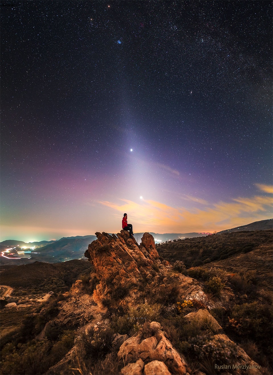 What's causing that unusual ray of light extending from the horizon? Dust orbiting the Sun. At certain times of the year, a band of sun-reflecting dust from the inner Solar System appears prominently after sunset or before sunrise and is called zodiacal light. The dust was emitted mostly from faint Jupiter-family comets and slowly spirals into the Sun. The featured HDR image, acquired in mid-February from the Sierra Nevada National Park in Spain, captures the glowing band of zodiacal light going right in front of the bright evening planets Jupiter (upper) and Venus (lower). Emitted from well behind the zodiacal light is a dark night sky that prominently includes the Pleiades star cluster. Jupiter and Venus are slowly switching places in the evening sky, and just in the next few days nearing their closest angular approach.