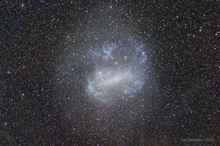 Is this a spiral galaxy? No. Actually, it is the Large Magellanic Cloud (LMC), the largest satellite galaxy of our own Milky Way Galaxy. The LMC is classified as a dwarf irregular galaxy because of its normally chaotic appearance. In this deep and wide exposure, however, the full extent of the LMC becomes visible. Surprisingly, during longer exposures, the LMC begins to resemble a barred spiral galaxy. The Large Magellanic Cloud lies only about 180,000 light-years distant towards the constellation of the Dolphinfish (Dorado). Spanning about 15,000 light-years, the LMC was the site of SN1987A, the brightest and closest supernova in modern times. Together with the Small Magellanic Cloud (SMC), the LMC can be seen in Earth's southern hemisphere with the unaided eye. Your Sky Surprise: What picture did APOD feature on your birthday? (post 1995)