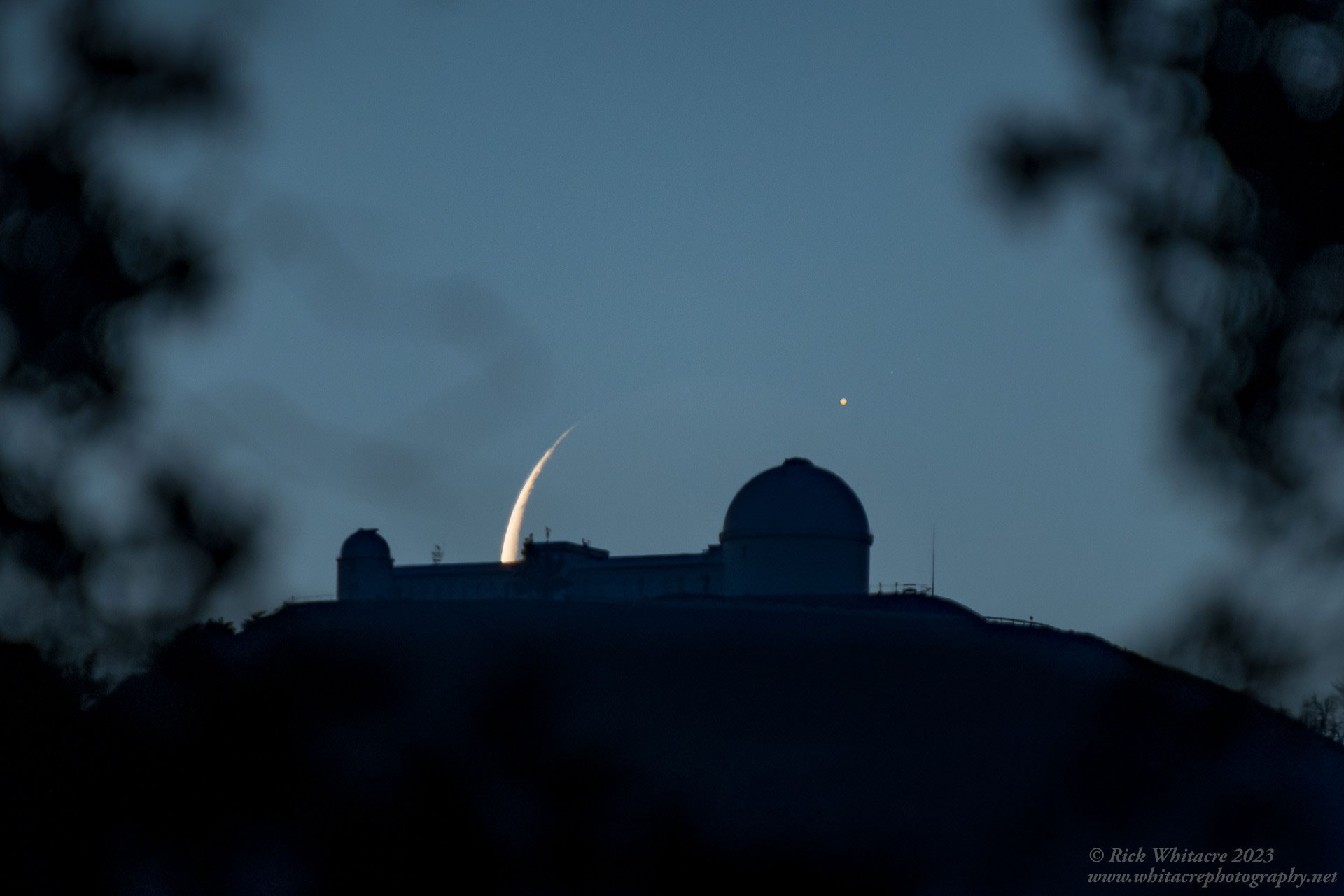 Sometimes we witness the Moon moving directly in front of -- called occulting -- one of the planets in our Solar System. Earlier this month that planet was Jupiter. Captured here was the moment when Jupiter re-appeared from behind the surface of our Moon. The Moon was in its third quarter, two days before the dark New Moon. Now, our Moon is continuously half lit by the Sun, but when in its third quarter, relatively little of that half can be seen from the Earth. Pictured, the Moon itself was aligned behind the famous Lick Observatory in California, USA, on the summit of Mount Hamilton. Coincidentally, Lick enabled the discovery of a moon of Jupiter: Amalthea, the last visually detected moon of Jupiter after Galileo's observations. Gallery: Moon Occults Jupiter in 2023 May: Notable Submissions to APOD