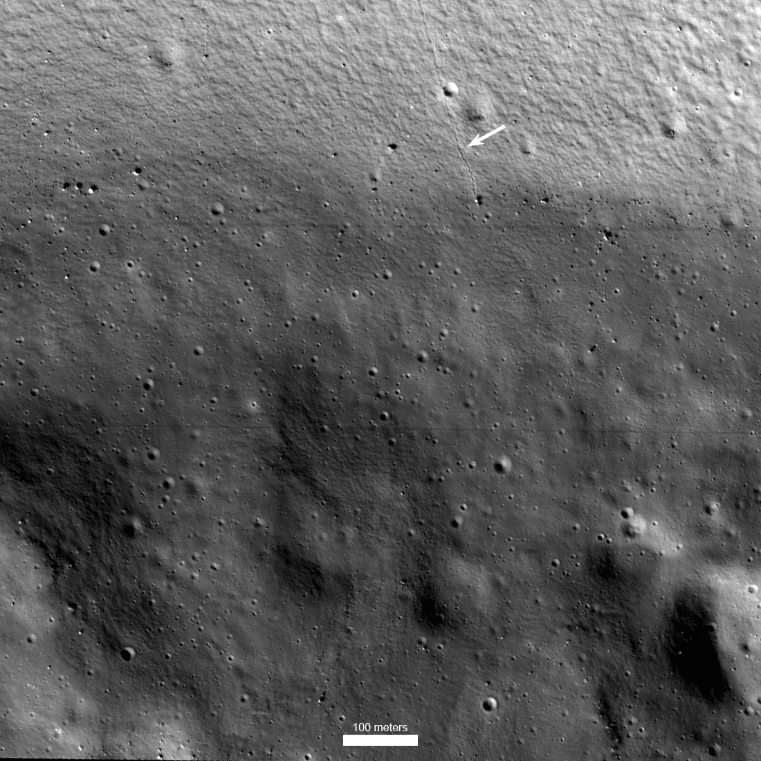 Shackleton crater lies at the lunar south pole. Peaks along the rim of the 21 kilometer diameter crater are in sunlight, but Shackleton's floor is in dark permanent shadow. Still, this image of the shadowed rim wall and floor of Shackleton crater was captured from NASA's ShadowCam, an instrument on board the Korea Pathfinder Lunar Orbiter (KPLO) launched in August 2022. About 200 times more sensitive than, for example, the Lunar Reconnaissance Orbiter's Narrow Angle Camera, ShadowCam was designed to image the permanently shadowed regions of the lunar surface. Avoiding direct sunlight, those regions are expected to be reservoirs of water-ice and other volatiles deposited by ancient cometary impacts and useful to future Moon missions. Of course, the permanently shadowed regions are still illuminated by reflections of sunlight from nearby lunar terrain. In this stunningly detailed ShadowCam image, an arrow marks the track made by a single boulder rolling down Shackleton crater's wall. The image scale is indicated at the bottom of the frame.