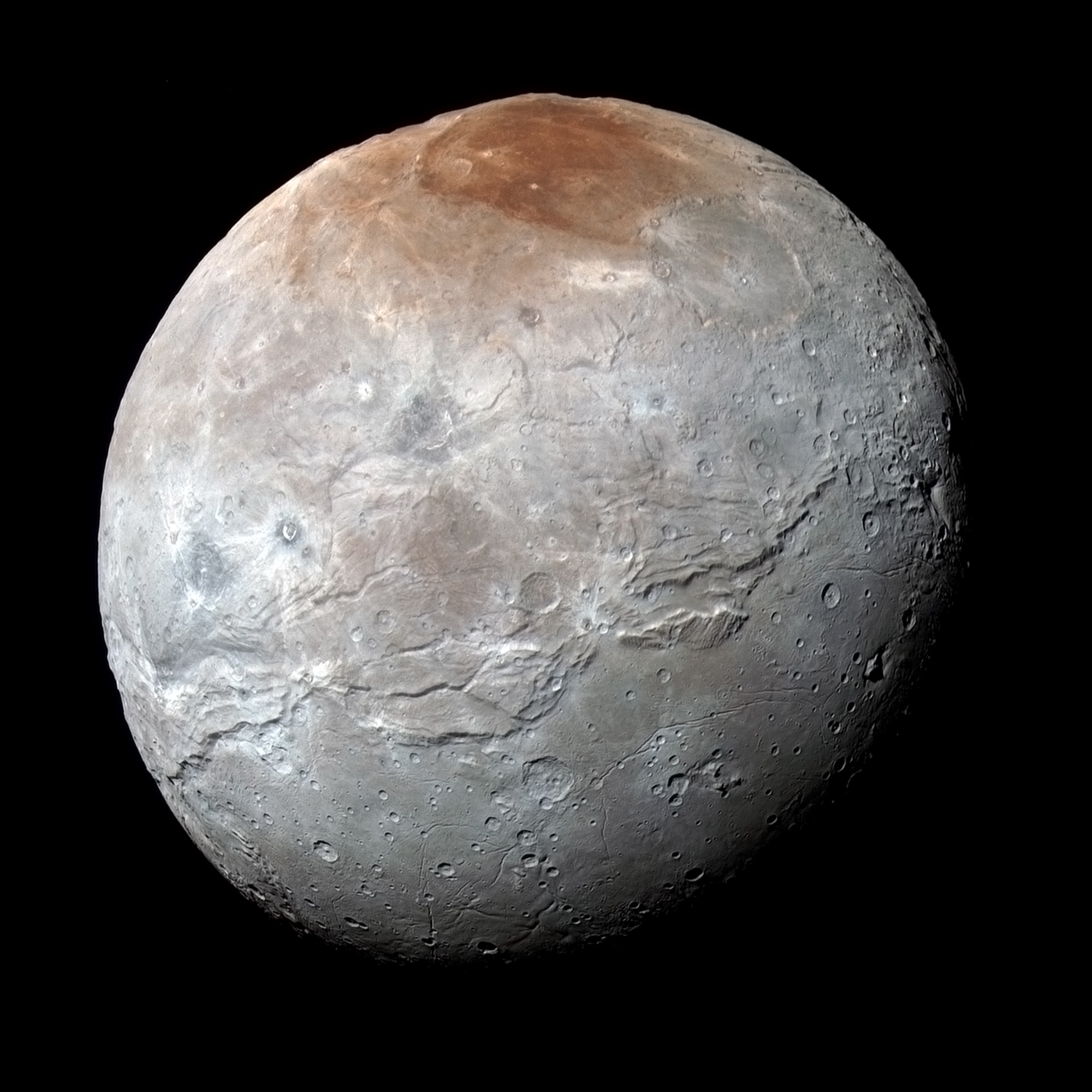 A darkened and mysterious north polar region known to some as Mordor Macula caps this premier high-resolution view. The portrait of Charon, Pluto's largest moon, was captured by New Horizons near the spacecraft's closest approach on July 14, 2015. The combined blue, red, and infrared data was processed to enhance colors and follow variations in Charon's surface properties with a resolution of about 2.9 kilometers (1.8 miles). A stunning image of Charon's Pluto-facing hemisphere, it also features a clear view of an apparently moon-girdling belt of fractures and canyons that seems to separate smooth southern plains from varied northern terrain. Charon is 1,214 kilometers (754 miles) across. That's about 1/10th the size of planet Earth but a whopping 1/2 the diameter of Pluto itself, and makes it the largest satellite relative to its parent body in the Solar System. Still, the moon appears as a small bump at about the 1 o'clock position on Pluto's disk in the grainy, negative,telescopic picture inset at upper left. That view was used by James Christy and Robert Harrington at the U.S. Naval Observatory in Flagstaff to discover Charon in June of 1978.