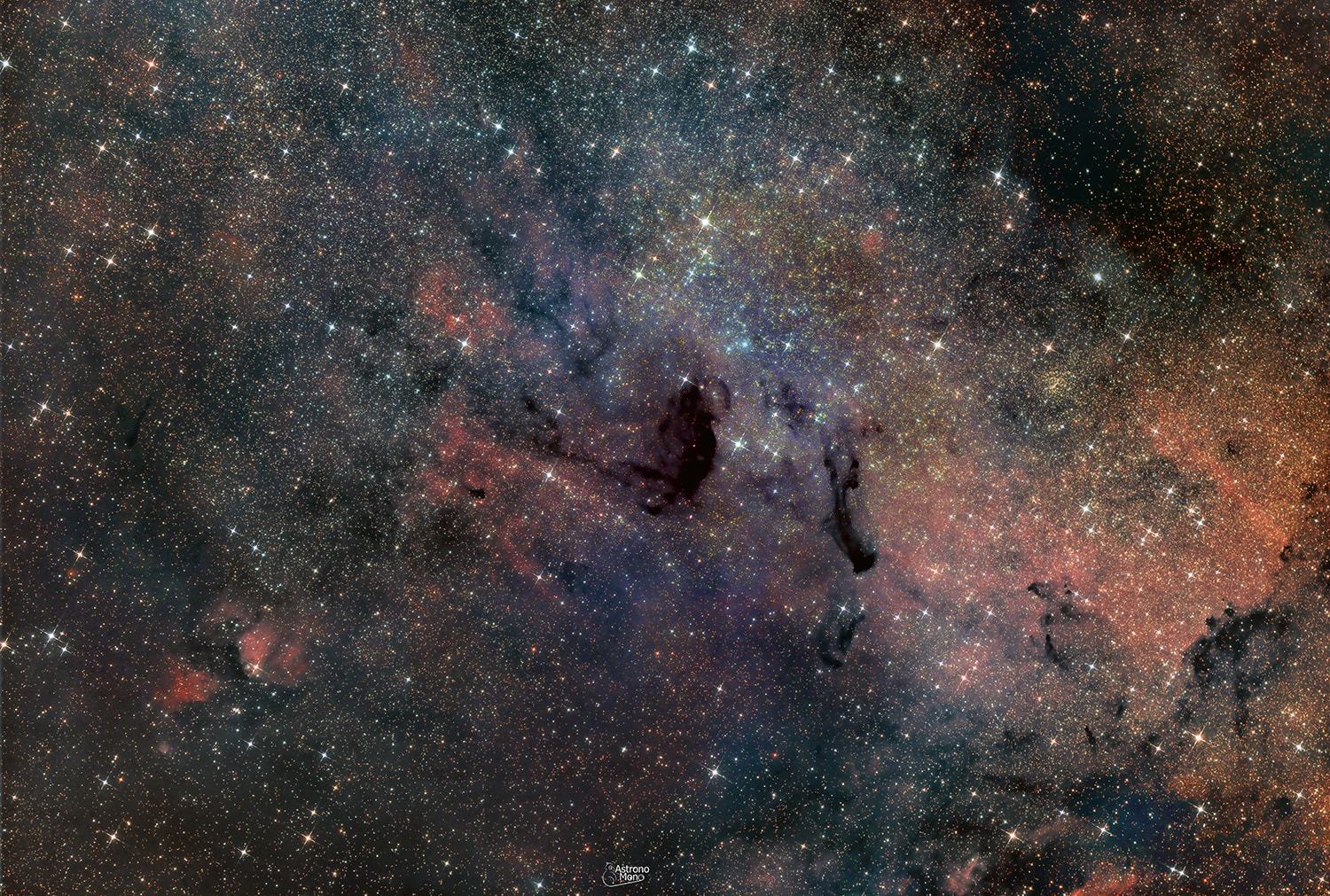 Unlike most entries in Charles Messier's famous catalog of deep sky objects, M24 is not a bright galaxy, star cluster, or nebula. It's a gap in nearby, obscuring interstellar dust clouds that allows a view of the distant stars in the Sagittarius spiral arm of our Milky Way galaxy. Direct your gaze through this gap with binoculars or small telescope and you are looking through a window over 300 light-years wide at stars some 10,000 light-years or more from Earth. Sometimes called the Small Sagittarius Star Cloud, M24's luminous stars fill this gorgeous starscape. Covering over 3 degrees or the width of 6 full moons in the constellation Sagittarius, the telescopic field of view includes dark markings B92 and B93 near center, along with other clouds of dust and glowing nebulae toward the center of the Milky Way.