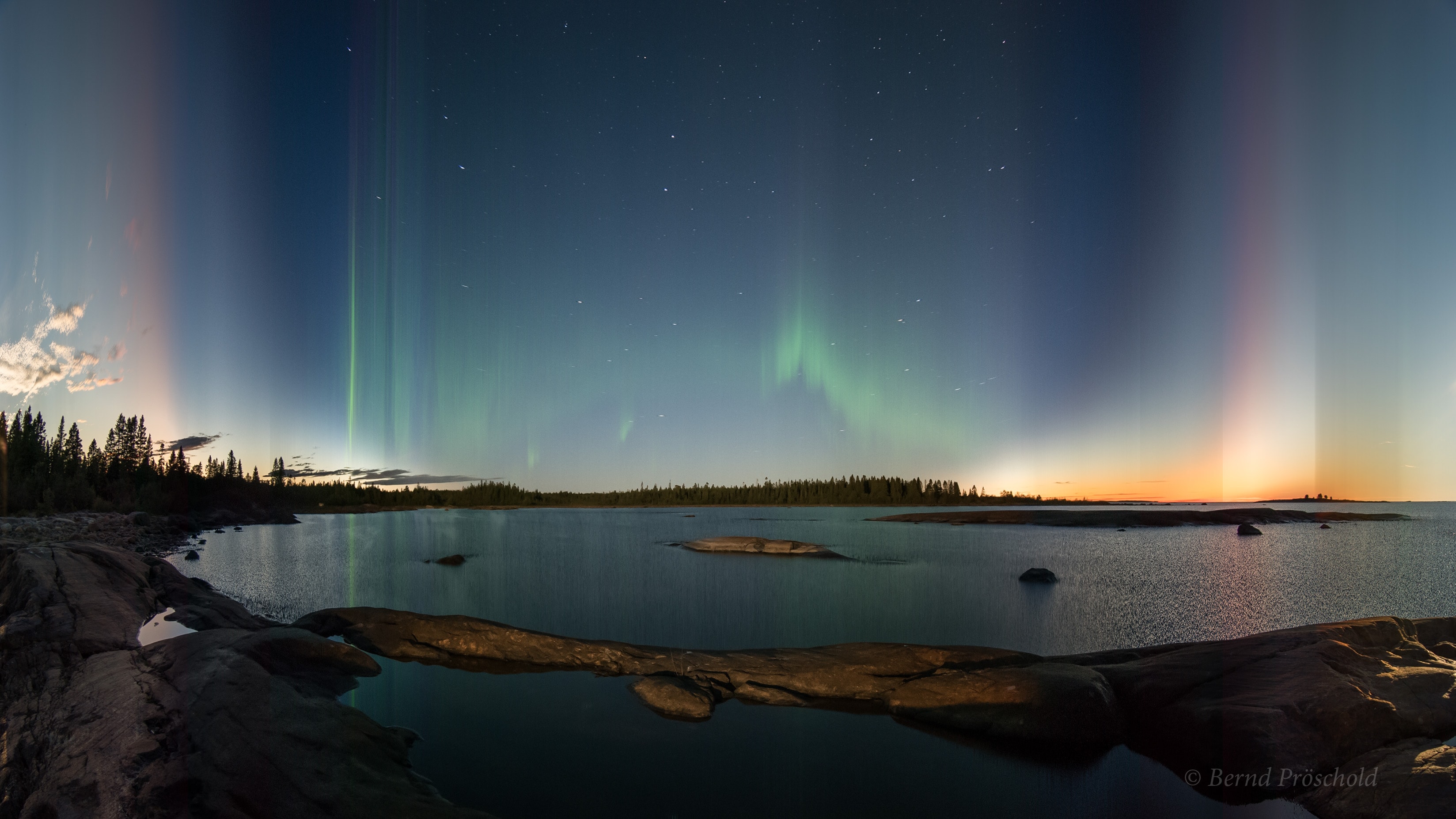 This serene view from the coast of Sweden looks across the Baltic sea and compresses time, presenting the passage of one night in a single photograph. From sunset to sunrise, moonlight illuminates the creative sea and skyscape. Fleeting clouds, fixed stars, and flowing northern lights leave their traces in planet Earth's sky. To construct the timelapse image, 3296 video frames were recorded on the night of a nearly full moon between 7:04pm and 6:35am local time. As time progresses from left to right, a single column of pixels was taken from the corresponding individual frame and combined in sequence into a single digital image 3296 pixels wide. Happy Birthday APOD