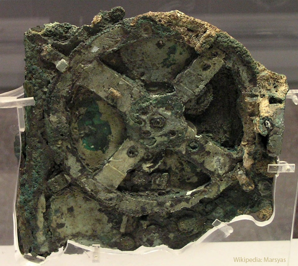 It does what? No one knew that 2,000 years ago, the technology existed to build such a device. The Antikythera mechanism, pictured, is now widely regarded as the first computer. Found at the bottom of the sea aboard a decaying Greek ship, its complexity prompted decades of study, and even today some of its functions likely remain unknown. X-ray images of the device, however, have confirmed that a main function of its numerous clock-like wheels and gears is to create a portable, hand-cranked, Earth-centered, orrery of the sky, predicting future star and planet locations as well as lunar and solar eclipses. The corroded core of the Antikythera mechanism's largest gear is featured, spanning about 13 centimeters, while the entire mechanism was 33 centimeters high, making it similar in size to a large book. Recently, modern computer modeling of missing components is allowing for the creation of a more complete replica of this surprising ancient machine.