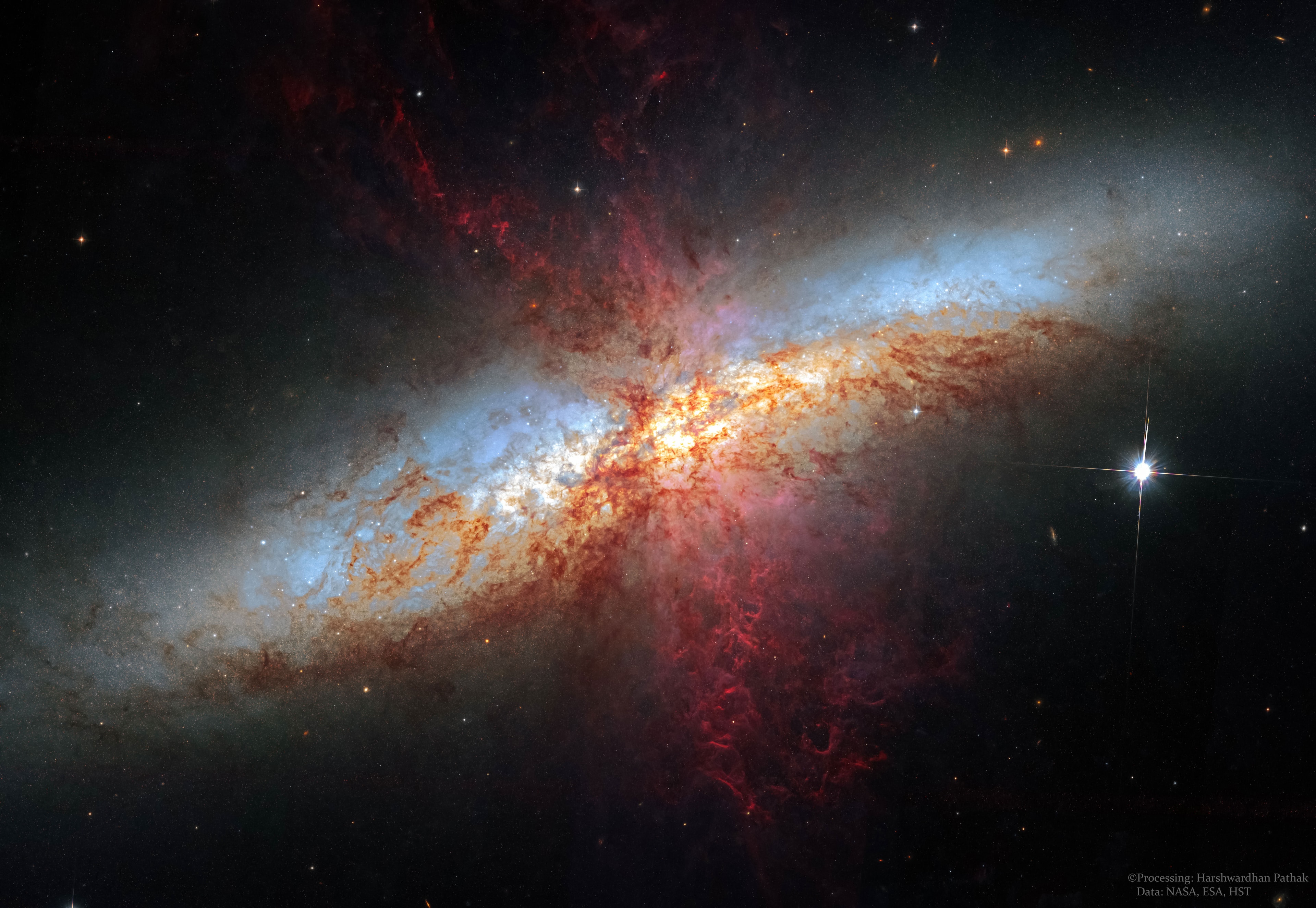 Why is the Cigar Galaxy billowing red smoke? M82, as this starburst galaxy is also known, was stirred up by a recent pass near large spiral galaxy M81. This doesn't fully explain the source of the red-glowing outwardly expanding gas and dust, however. Evidence indicates that this gas and dust is being driven out by the combined emerging particle winds of many stars, together creating a galactic superwind. The dust particles are thought to originate in M82's interstellar medium and are actually similar in size to particles in cigar smoke. The featured photographic mosaic highlights a specific color of red light strongly emitted by ionized hydrogen gas, showing detailed filaments of this gas and dust. The filaments extend for over 10,000 light years. The 12-million light-year distant Cigar Galaxy is the brightest galaxy in the sky in infrared light and can be seen in visible light with a small telescope towards the constellation of the Great Bear (Ursa Major). APOD in world languages: Arabic, Bulgarian, Catalan, Chinese (Beijing), Chinese (Taiwan), Croatian, Czech, Dutch, French, German, Hebrew, Indonesian, Japanese, Montenegrin, Polish, Russian, Serbian, Slovenian, Spanish, Taiwanese, Turkish, and Ukrainian