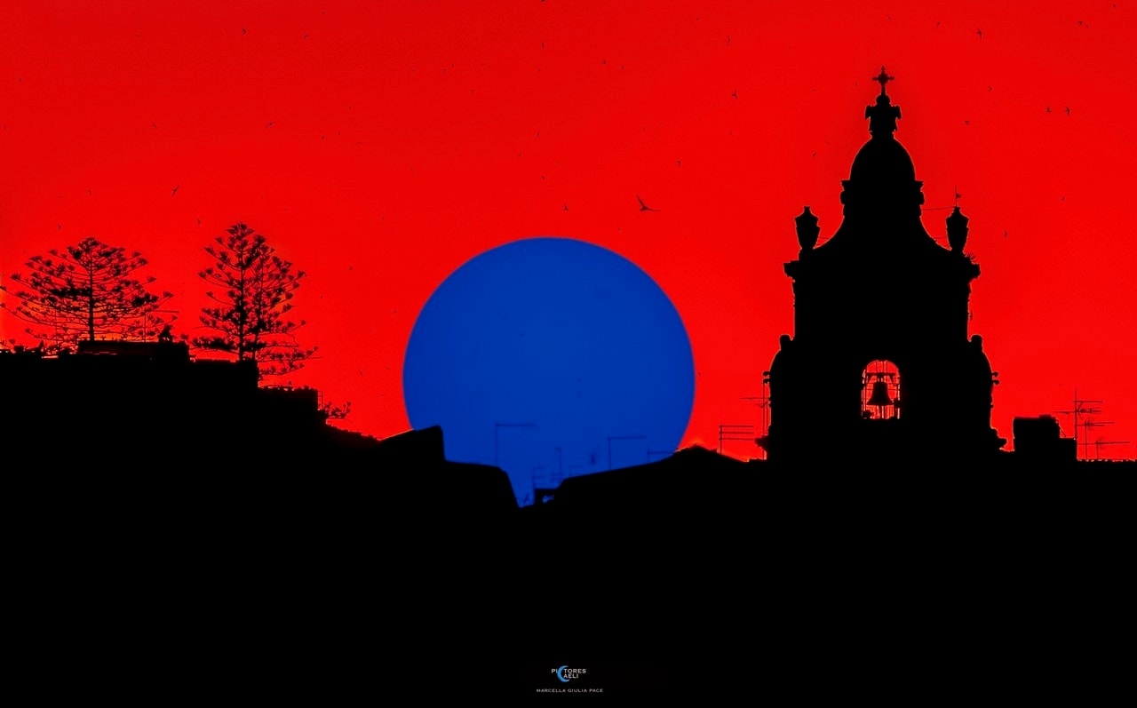 On May 7, the Sun setting behind a church bell tower was captured in this filtered and manipulated digital skyscape from Ragusa, Sicily, planet Earth. In this version of the image the colors look bizarre. Still, an intriguing optical illusion known as an afterimage can help you experience the same scene with a more natural looking appearance. To try it, find the sunspots of active region AR4079 grouped near the bottom of the blue solar disk. Relax and stare at the dark sunspot group for about 30 seconds, then close your eyes or shift your gaze to a plain white surface. In a moment an afterimage of the sunset should faintly appear. But the afterimage sunset will have this image's complementary colors and a more normal yellow Sun against a familiar blue sky.