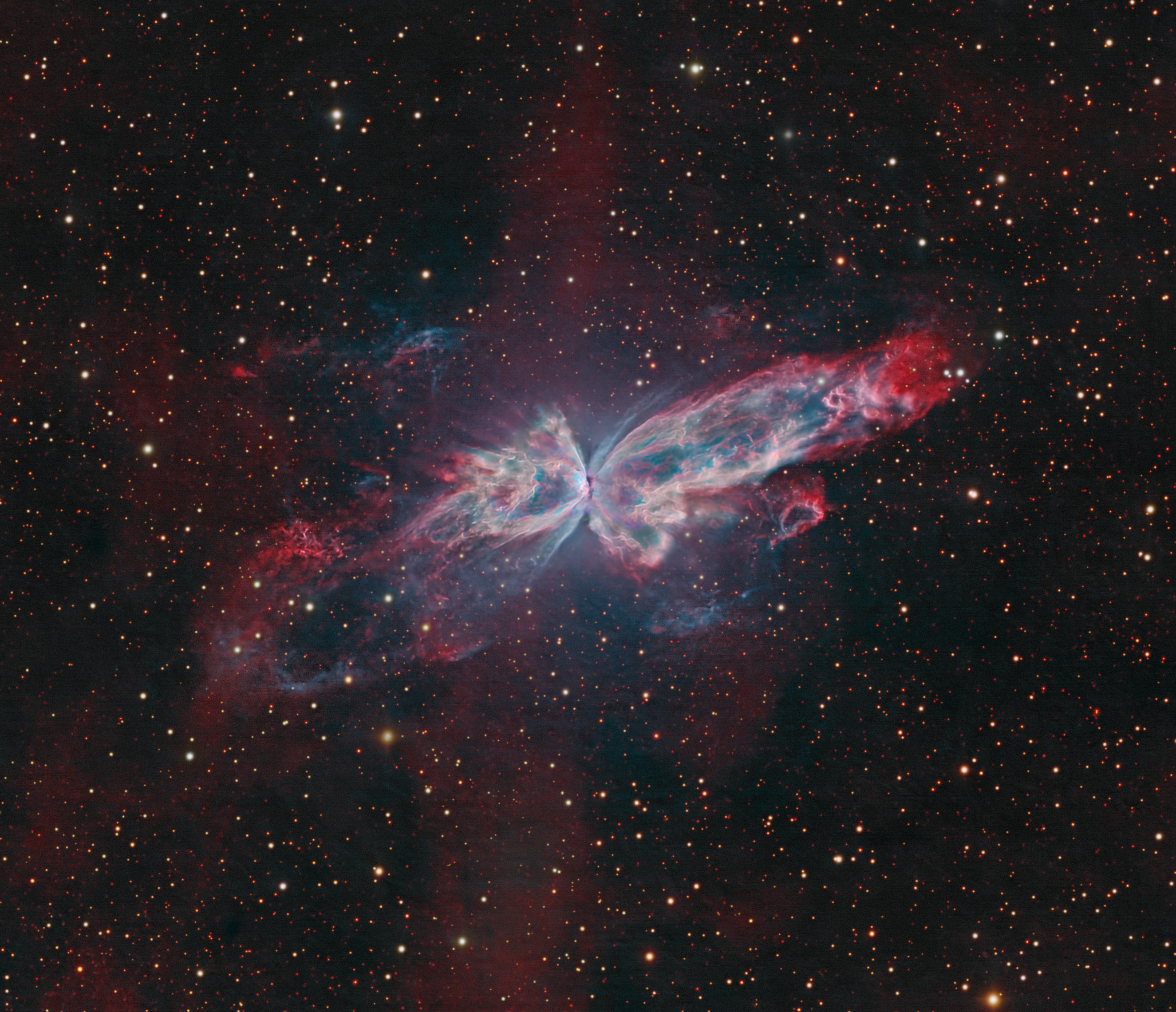 The bright clusters and nebulae of planet Earth's night sky are often given the names of flowers or insects, and its whopping 3 light-year wingspan, NGC 6302 is no exception. With an estimated surface temperature of about 250,000 degrees C, the central star of the planetary nebula is transforming into a white dwarf star, becoming exceptionally hot, and shining brightly in ultraviolet light. The central star is hidden from direct view by a torus of dust, but its energetic ultraviolet light ionizes atoms in the nebula. In this sharp, telescopic view composed with narrowband image data, the ionized hydrogen and doubly ionized oxygen atoms are shown in their characteristic red and blue-green hues to reveal a stunning complex of knots and filaments within the nebula's wing-like bipolar outflows. NGC 6302 lies about 4,000 light-years away in the arachnologically correct constellation of the Scorpion (Scorpius).