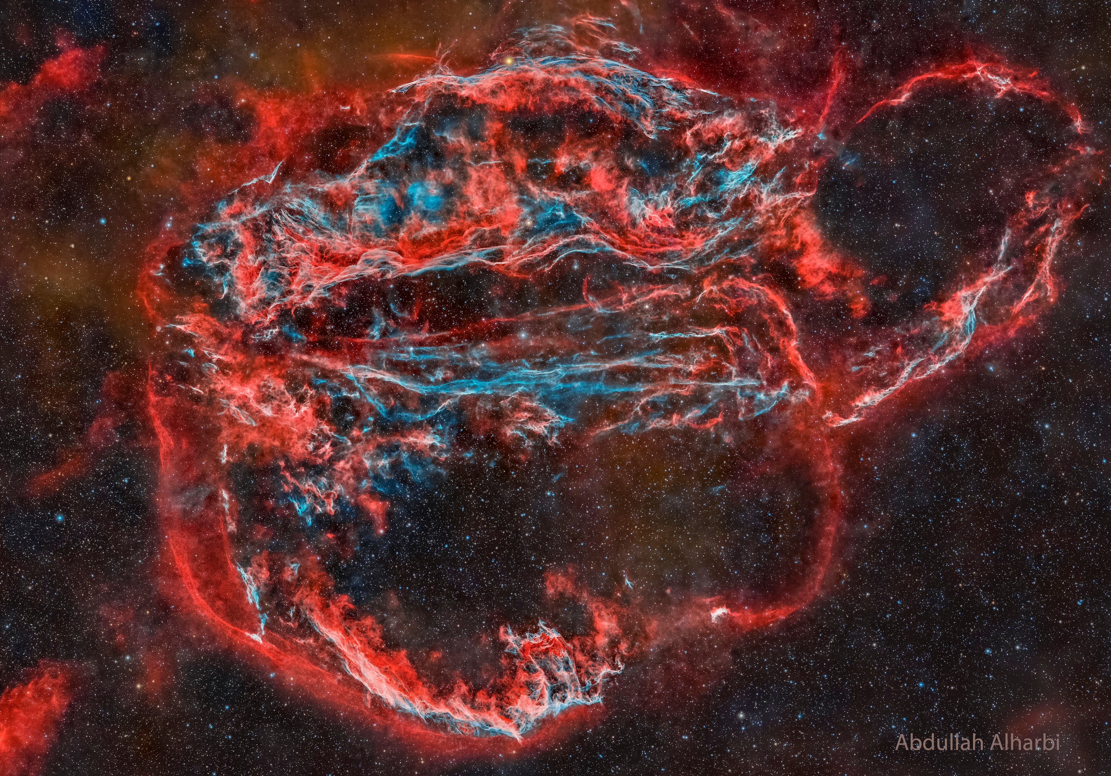Wisps like this are all that remain visible of a Milky Way star. About 7,000 years ago that star exploded in a supernova, leaving the Veil Nebula. At the time, the expanding cloud was likely as bright as a crescent Moon, remaining visible for weeks to people living at the dawn of recorded history. Today, the resulting supernova remnant, also known as the Cygnus Loop, has faded and is now visible only through a small telescope directed toward the constellation of the Swan (Cygnus). The remaining Veil Nebula is physically huge, however, and even though it lies about 1,400 light-years distant, it covers over five times the size of the full Moon. The featured picture was taken in Kuwait in mid-2024 and features light emitted by hydrogen in red and oxygen in blue. In deep images of the complete Veil Nebula like this, even studious readers might not be able to identify the iconic filaments. Piece it All Together: Astronomy Puzzle of the Day