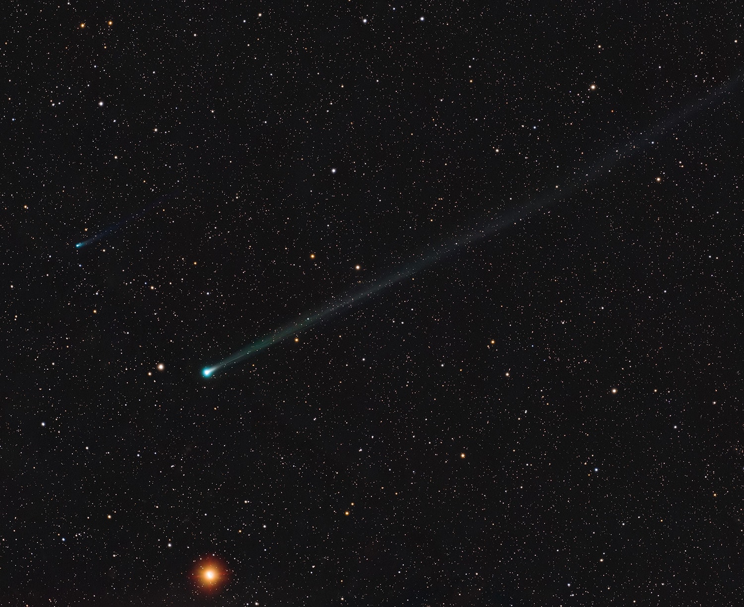 A new visitor to the inner Solar System, comet C/2025 R2 (SWAN) sports a long ion tail extending diagonally across this almost 7 degree wide telescopic field of view recorded on September 21. A fainter fellow comet also making its inner Solar System debut, C/2025 K1 (ATLAS), can be spotted above and left of SWAN's greenish coma, just visible against the background sea of stars in the constellation Virgo. Both new comets were only discovered in 2025 and are joined in this celestial frame by ruddy planet Mars (bottom), a more familiar wanderer in planet Earth's night skies. The comets may appear to be in a race, nearly neck and neck in their voyage through the inner Solar System and around the Sun. But this comet SWAN has already reached its perihelion or closest approach to the Sun on September 12 and is now outbound along its orbit. This comet ATLAS is still inbound though, and will make its perihelion passage on October 8.