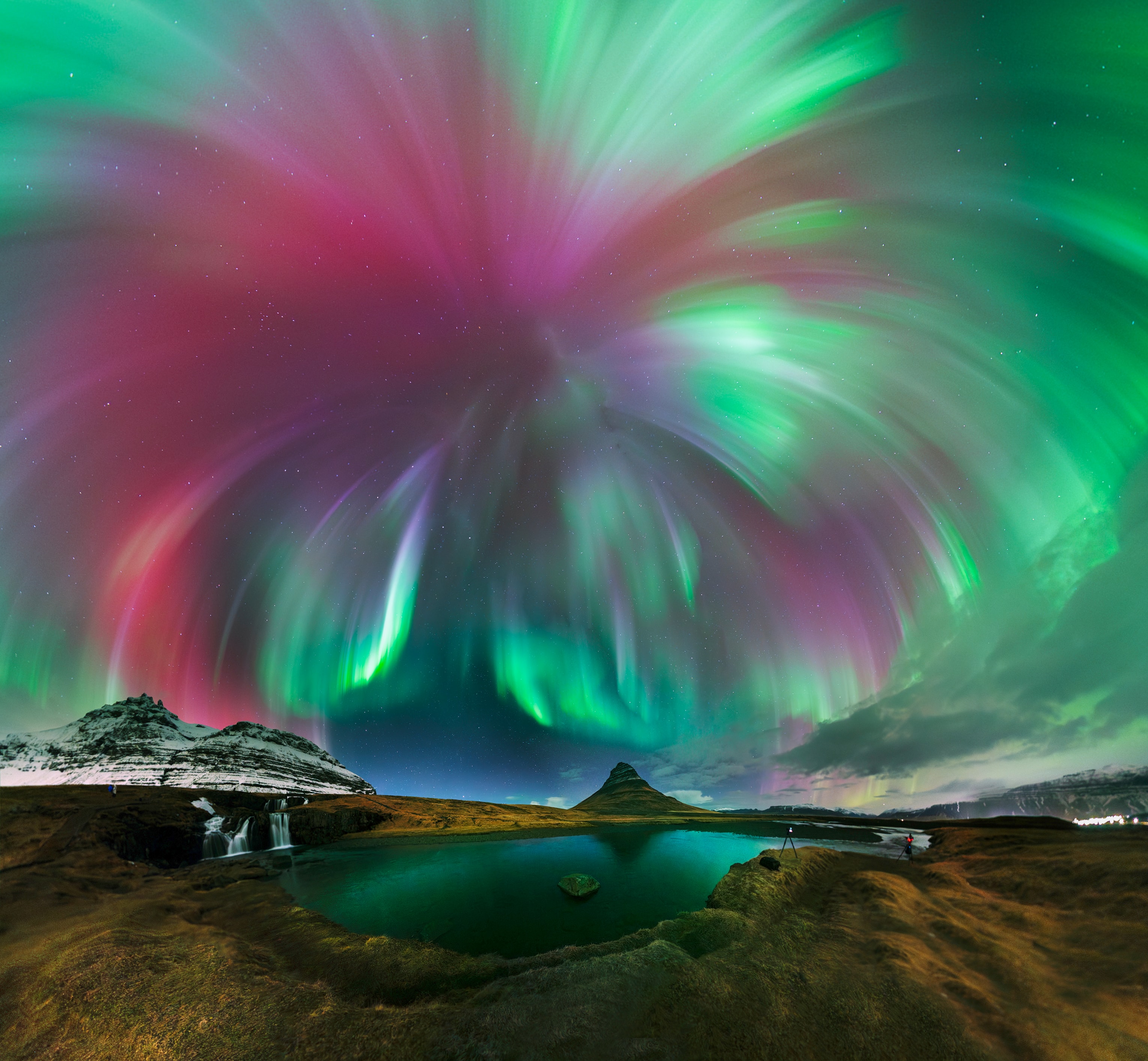 Cycle 25 solar maximum made 2025 a great year for aurora borealis (or aurora australis) on planet Earth. And the high level of solar activity should extend into 2026. So, while you're celebrating the arrival of the new year, check out this spectacular auroral display that erupted in starry night skies over Kirkjufell, Iceland. The awesome auroral corona, energetic curtains of light streaming from directly overhead, was witnessed during a strong geomagnetic storm triggered by intense solar activity near the March 2025 equinox. This northland and skyscape captures the evocative display in a 21 frame panoramic mosaic.