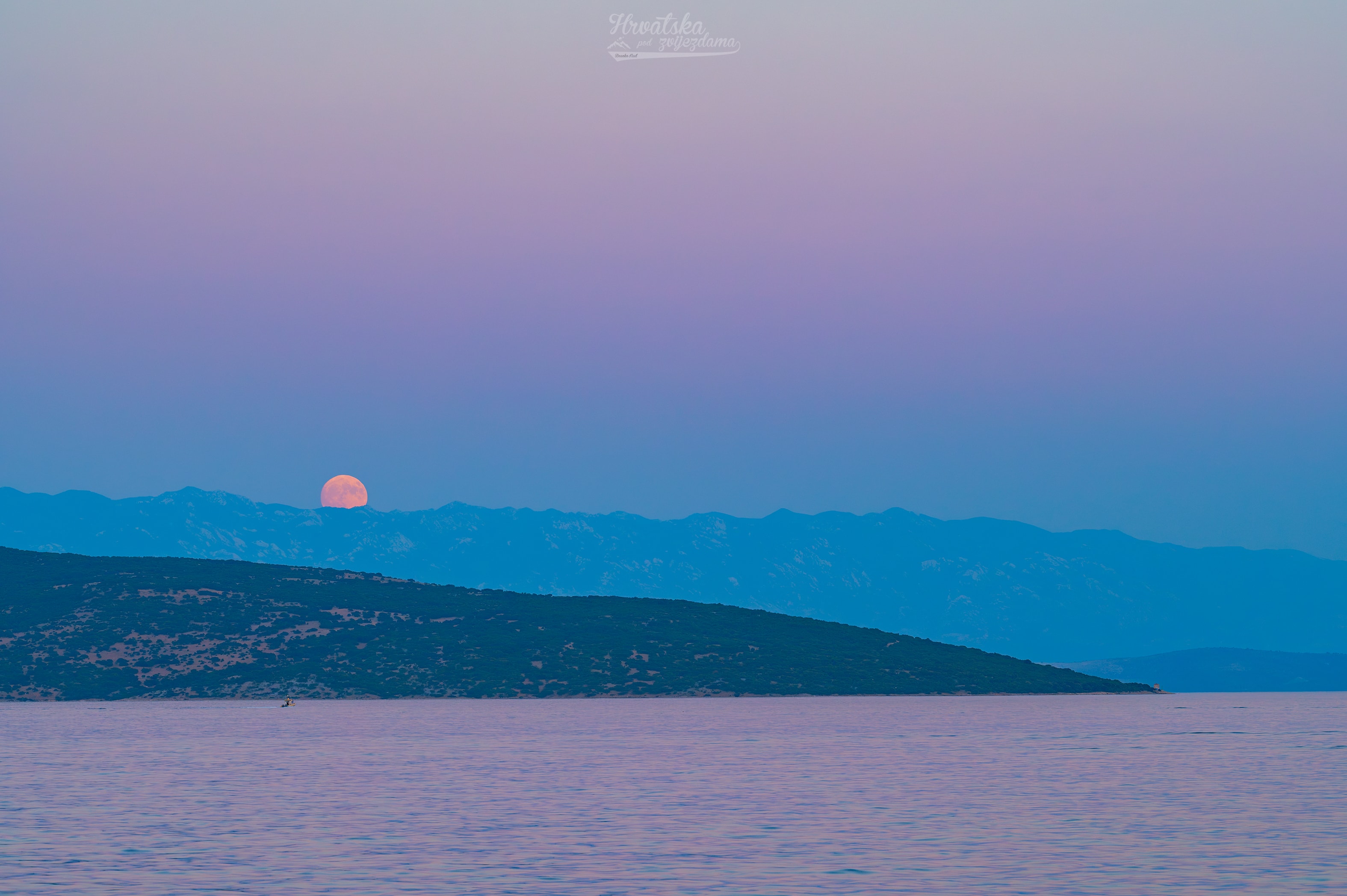 The Buck Moon is a traditional name for the full moon of July. In this colorful Adriatic sea and skyscape captured on July 28 from Krk Island along the coast of Croatia, a full Buck Moon is just rising over distant mountains. Since a full moon rises as the Sun sets, Earth's shadow also rises in the twilight scene, a diffuse gray band extending above the mountainous southeastern horizon. Above Earth's shadow band is the pinkish antitwilight arch. That subtly tinted band of backscattered sunlight is more widely known as the Belt of Venus. But as it shares the eastern horizon with the atmospheric shadow of Earth and Belt of Venus, this full Buck Moon seems to set the stage for the New Moon to come. The New Moon of August 12 will cast its shadow on planet Earth in a much anticipated total solar eclipse.