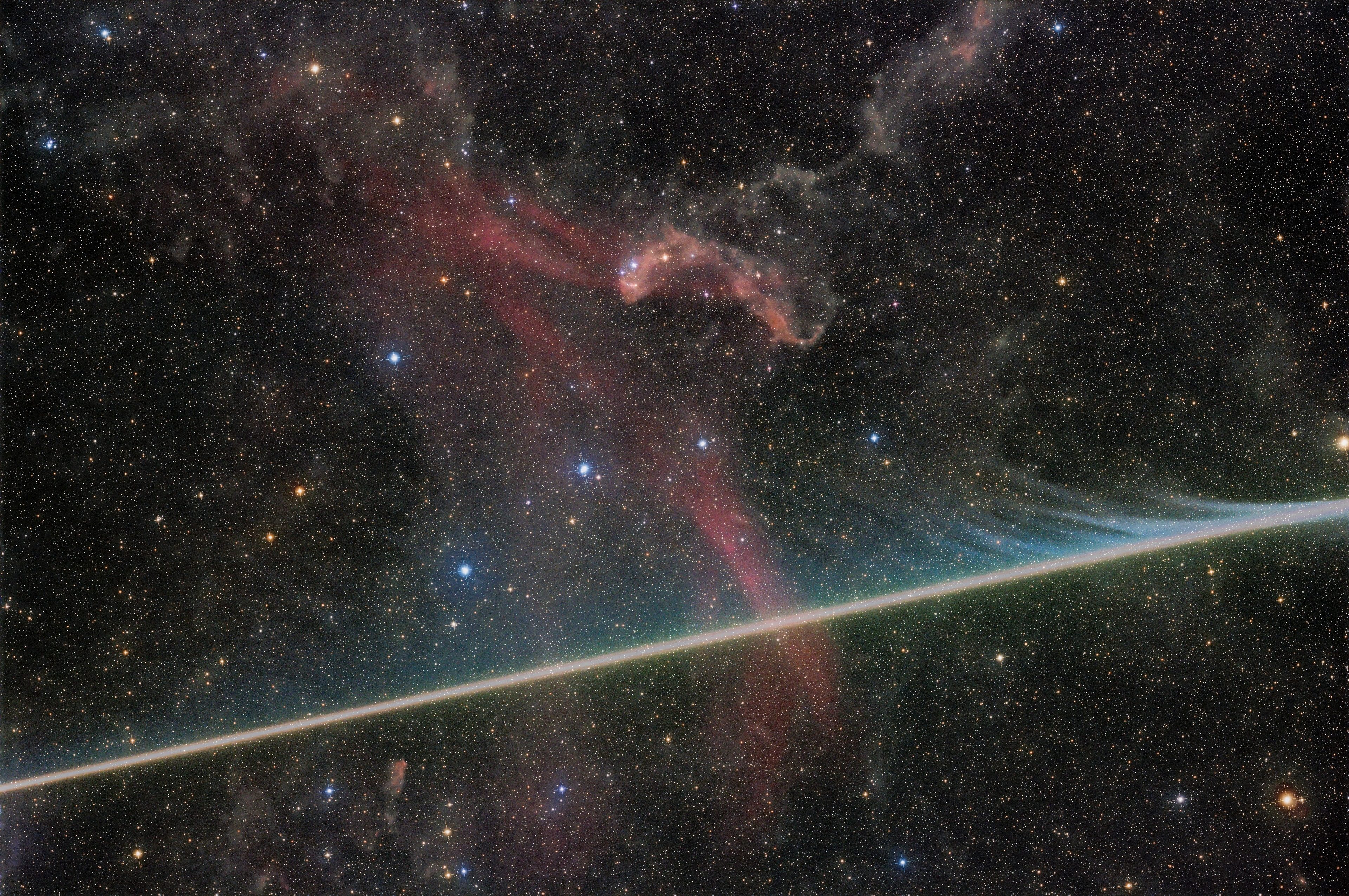 What's happening to this meteor? This bright meteor streak appeared and disappeared quickly during a long exposure of the Great Lacerta Nebula, seen faintly in red toward the center of the image. The meteoroid, likely a small pebble, creates its glow partly by heating and exciting surrounding air in Earth's atmosphere, but itself vaporizes and leaves wind-blown gas and dust with colors that give clues to its composition. The featured image was captured last month from Death Valley Observatories in Nevada, USA. This month, though, is particularly good for seeing meteors. Presently there are three meteor showers ongoing, although they are currently competing for visibility with the glow of a bright gibbous Moon. The most active of these showers, the Perseids, will be busiest in about 10 days -- after the Moon has dimmed considerably. This year, the Perseids peak nearly coincides with not only a new Moon, but, from some locations, one that totally eclipses the Sun. Sky Surprise: What picture did APOD feature on your birthday? (after 1995)
