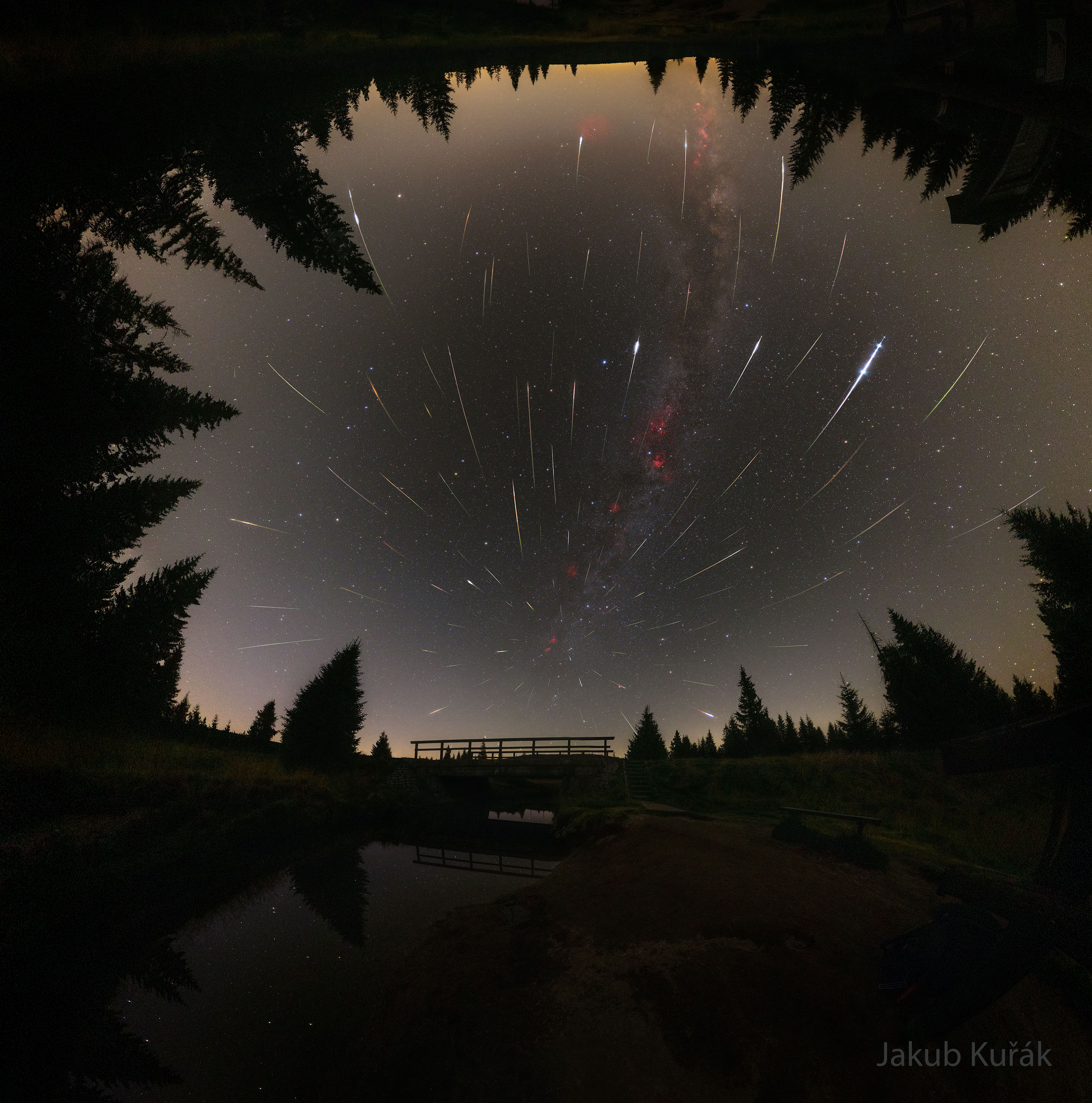 This was a good year for the Perseids meteor shower. A key reason was the Moon was absent from lighting up Earth's night sky so that more meteors were visible than usual. Where was the Moon? It was busy visiting the Sun. Near the Perseids peak, the Moon moved directly in front of the Sun and created a total solar eclipse visible from Greenland and Spain. The Perseids occur when the Earth collides with a stream of Sun-orbiting debris cast off by Comet Swift-Tuttle. Perseid meteors, although typically only the size of a sand grain, tend to be fast and bright because Swift-Tuttle's debris orbits the Sun in a direction partly opposite Earth's orbital motion. In the featured image compilation, accumulated over several nights from Jizerka in the Czech Republic, the Perseids meteor streaks can be traced back to a single location on the sky -- its radiant in Perseus. Gallery: Perseids Meteor Shower of 2026