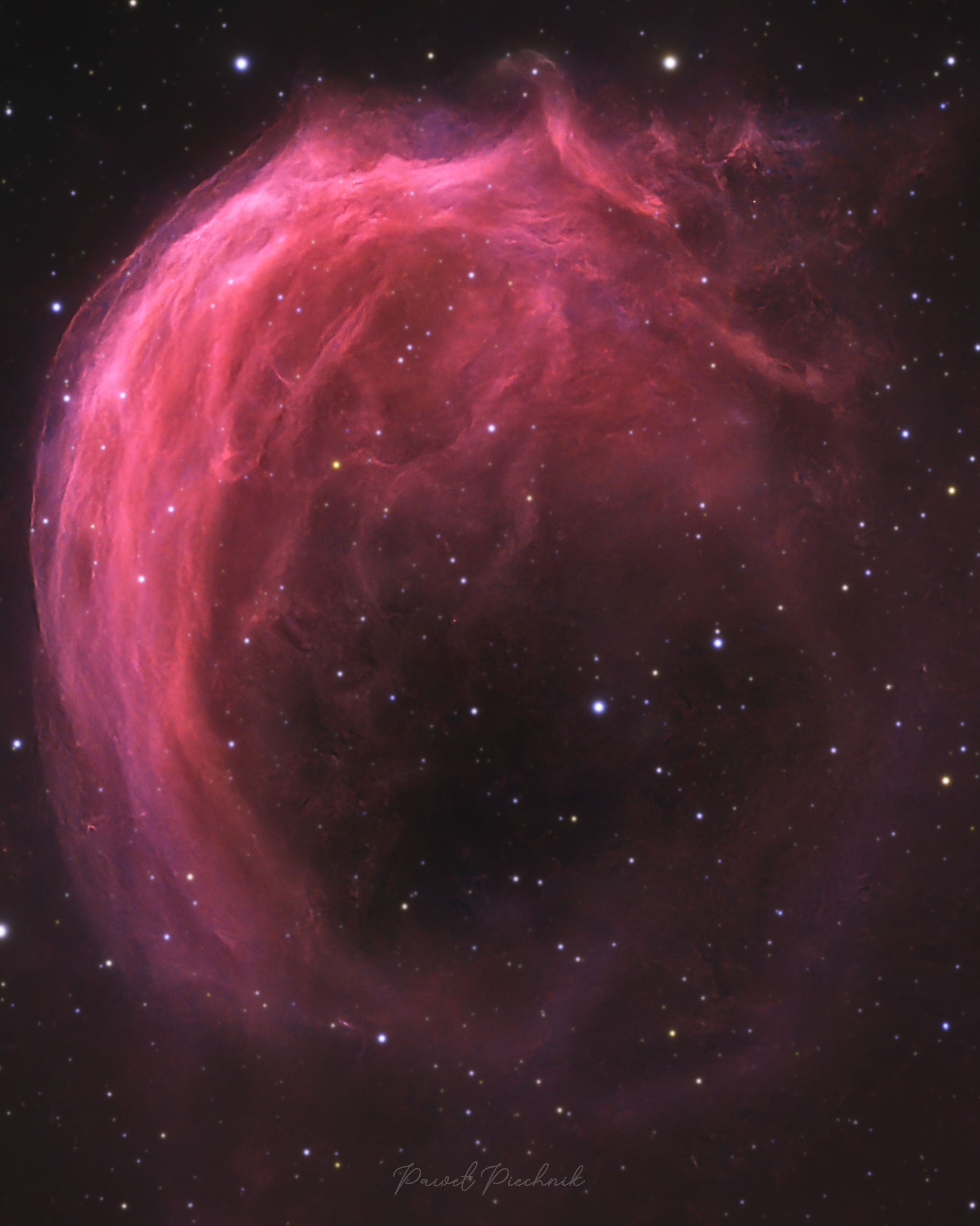 What causes the swirl in the Shrimp Nebula? Its high speed is likely. What is sure is that Sh2-188 is one of the larger planetary nebulas on the night sky, by angular size, spanning about half the diameter of the Moon. Moreover, the white-dwarf core -- leftover from the Sun-like star that shed its outer atmosphere -- is moving unusually fast through interstellar space, creating a bow shock most visible on the upper left that is similar to a boat plowing through water. Although faint, the Shrimp Nebula glows also by compressing and brightening gas on its leading edge. The featured image was taken in the light of hydrogen, sulfur, and oxygen by a backyard telescope in Krakow, Poland and then digitally adjusted to approximate the nebula's true colors. APOD's email for image submissions has changed. Please see: APOD Submissions APOD's main NASA site has moved: From apod.nasa.gov to science.nasa.gov/apod